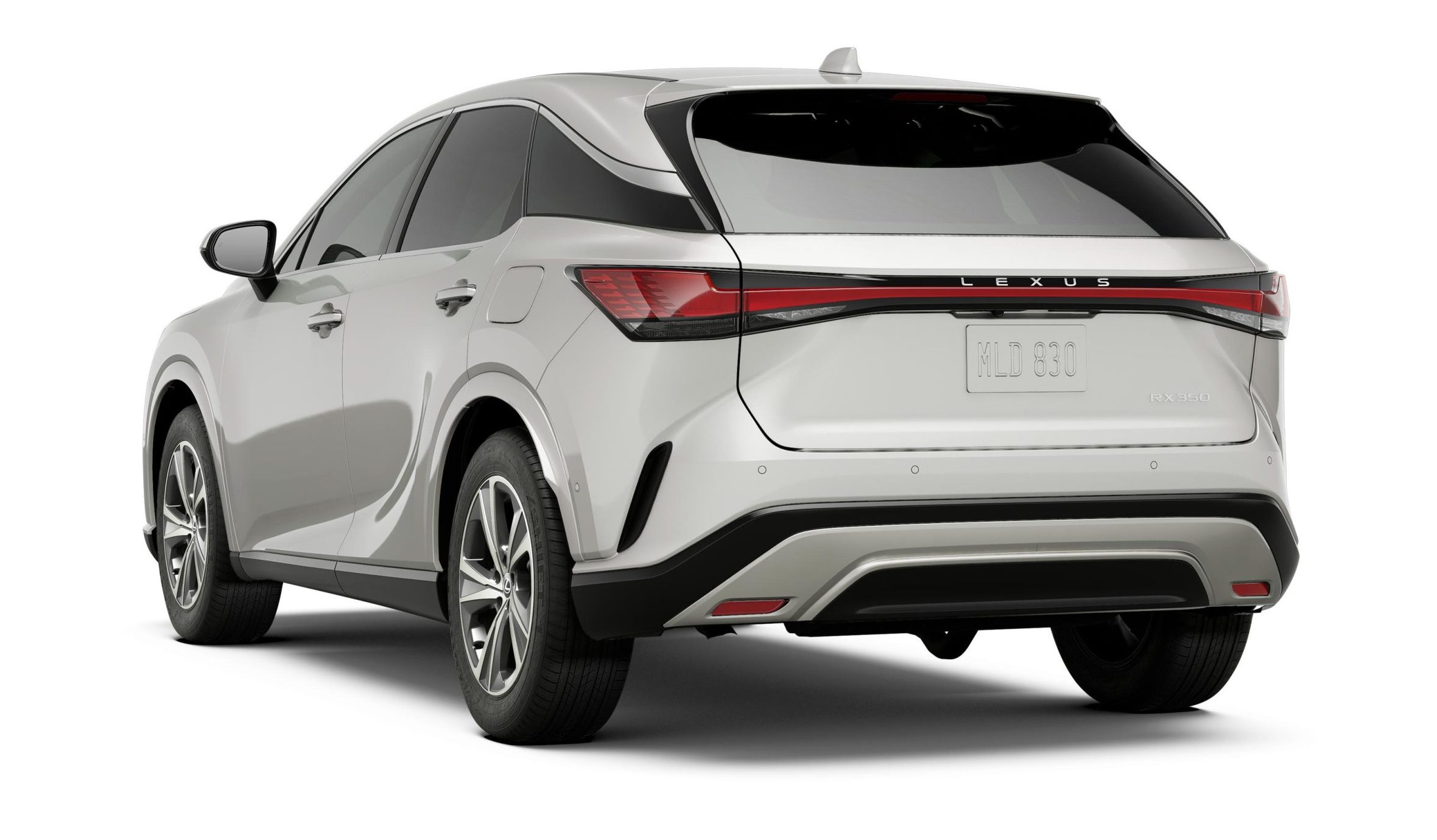 Rear view of the 2025 Lexus RX 350, highlighting its sleek body lines, stylish alloy wheels, and modern sculpted design.