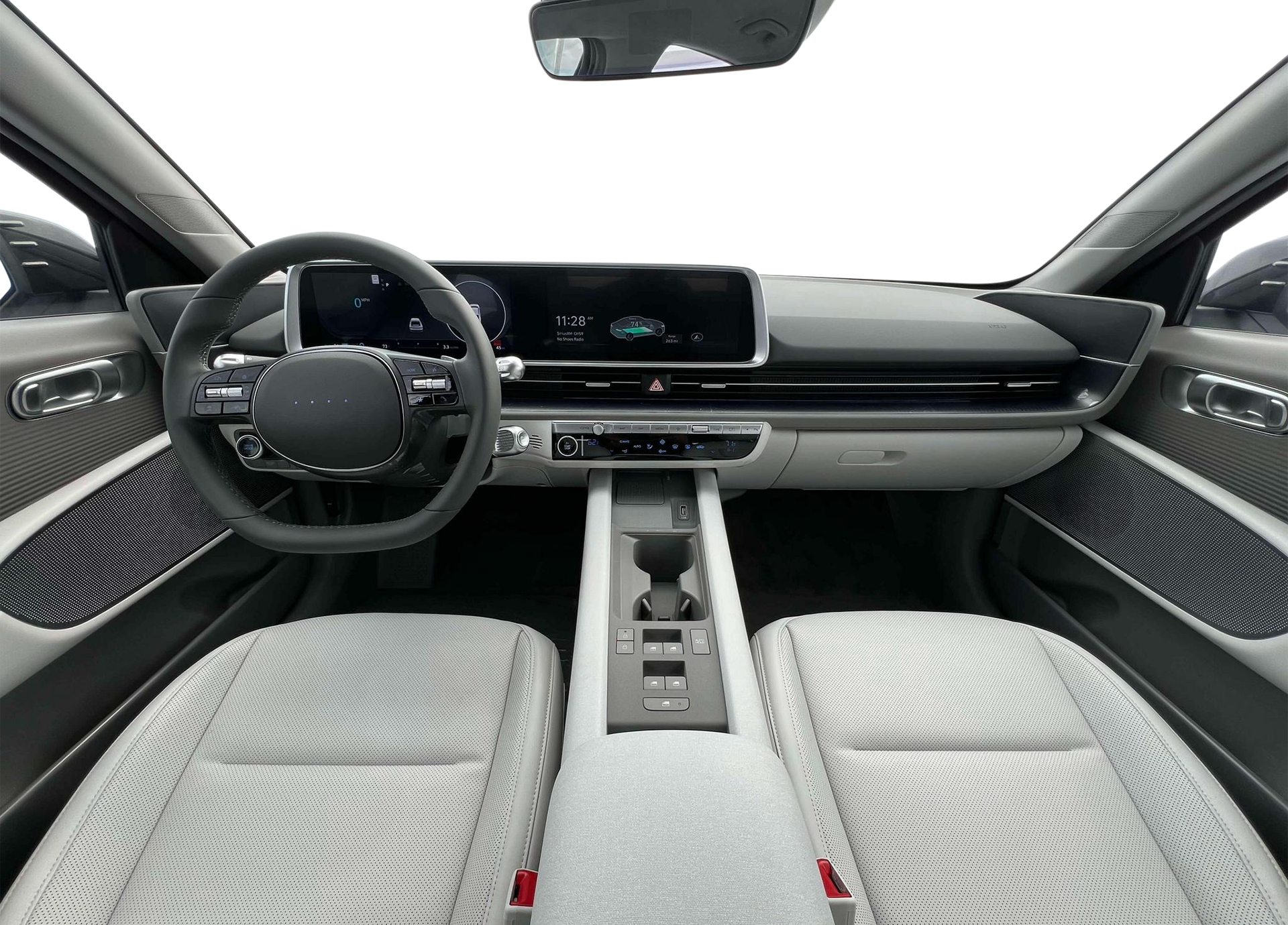 Interior dashboard of the 2025 Hyundai IONIQ-6, featuring a minimalist cockpit with dual 12.3-inch digital displays, modern steering wheel, and advanced EV controls.