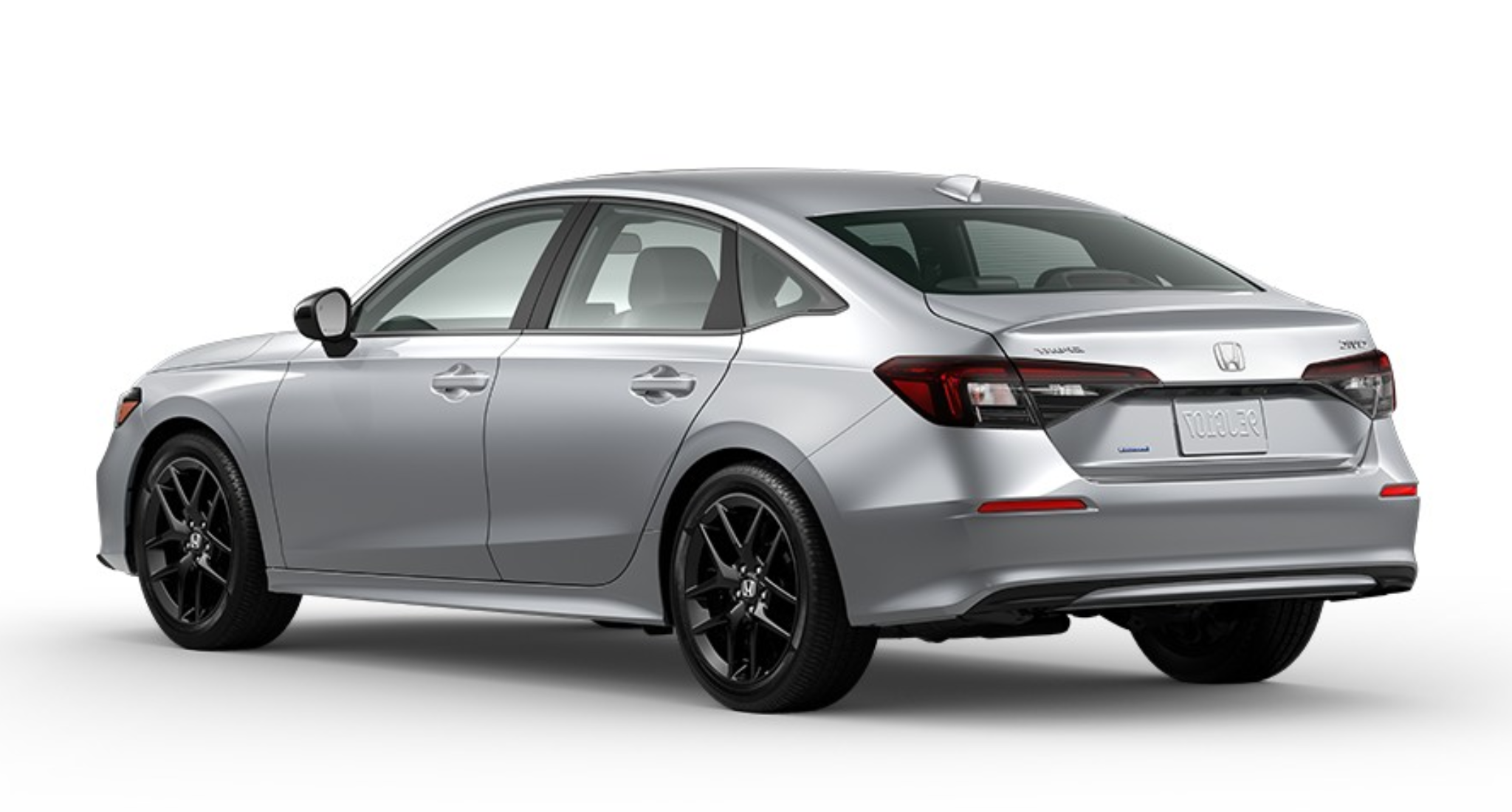 Rear three-quarter exterior view of the silver 2025 Honda Civic Sport Hybrid highlighting sleek design and sporty alloy wheels.