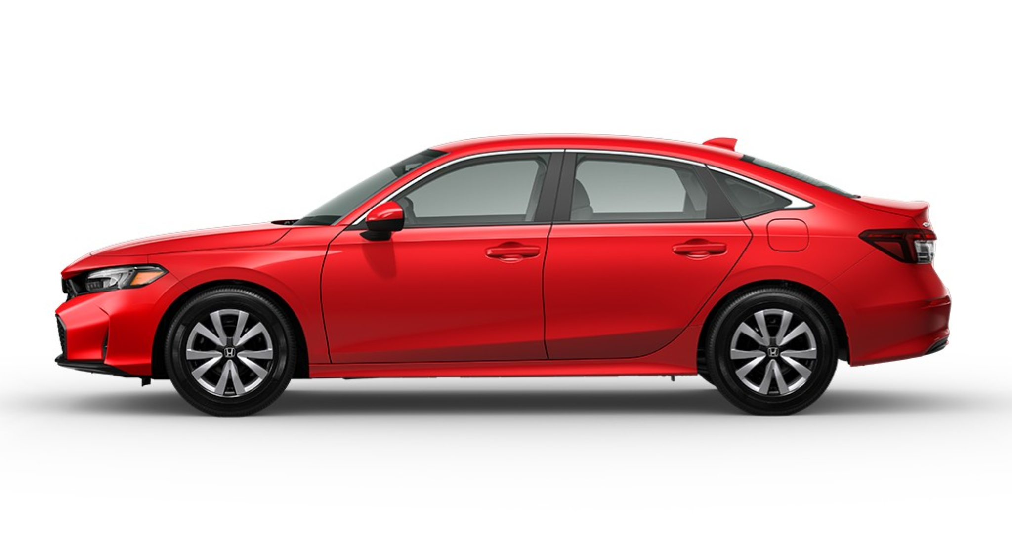 Side profile of the red 2025 Honda Civic LX highlighting streamlined design, steel wheels, and contemporary sedan styling.
