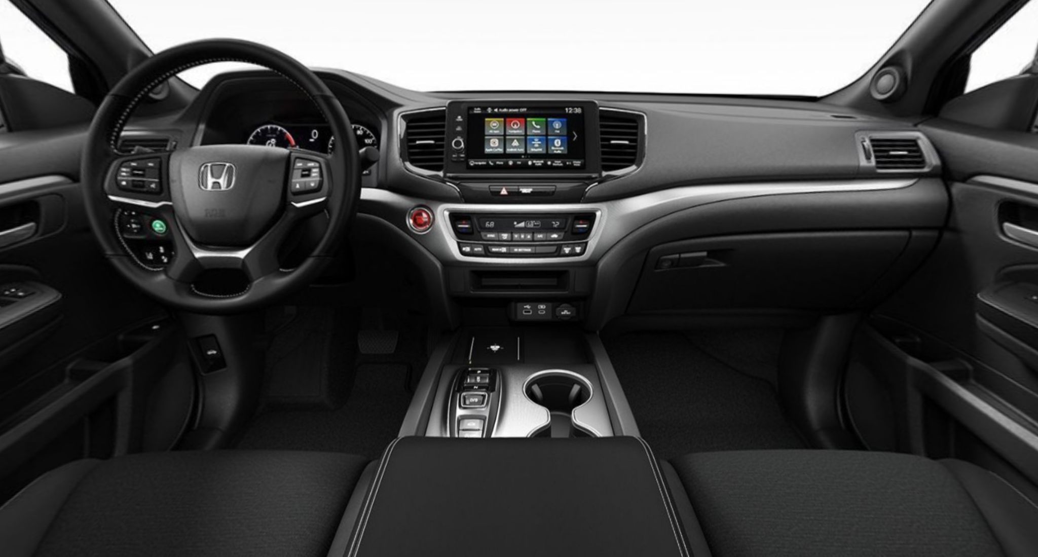 Interior view of the 2025 Honda Ridgeline Sport dashboard with 9-inch touchscreen, wireless Apple CarPlay, Android Auto, and modern climate controls.