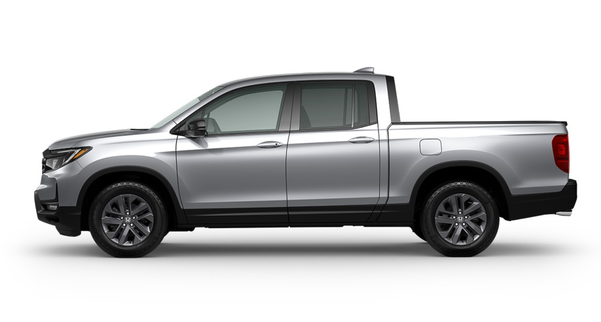Side profile of the 2025 Honda Ridgeline Sport midsize truck with crew cab configuration, 18-inch alloy wheels, and sleek body lines.