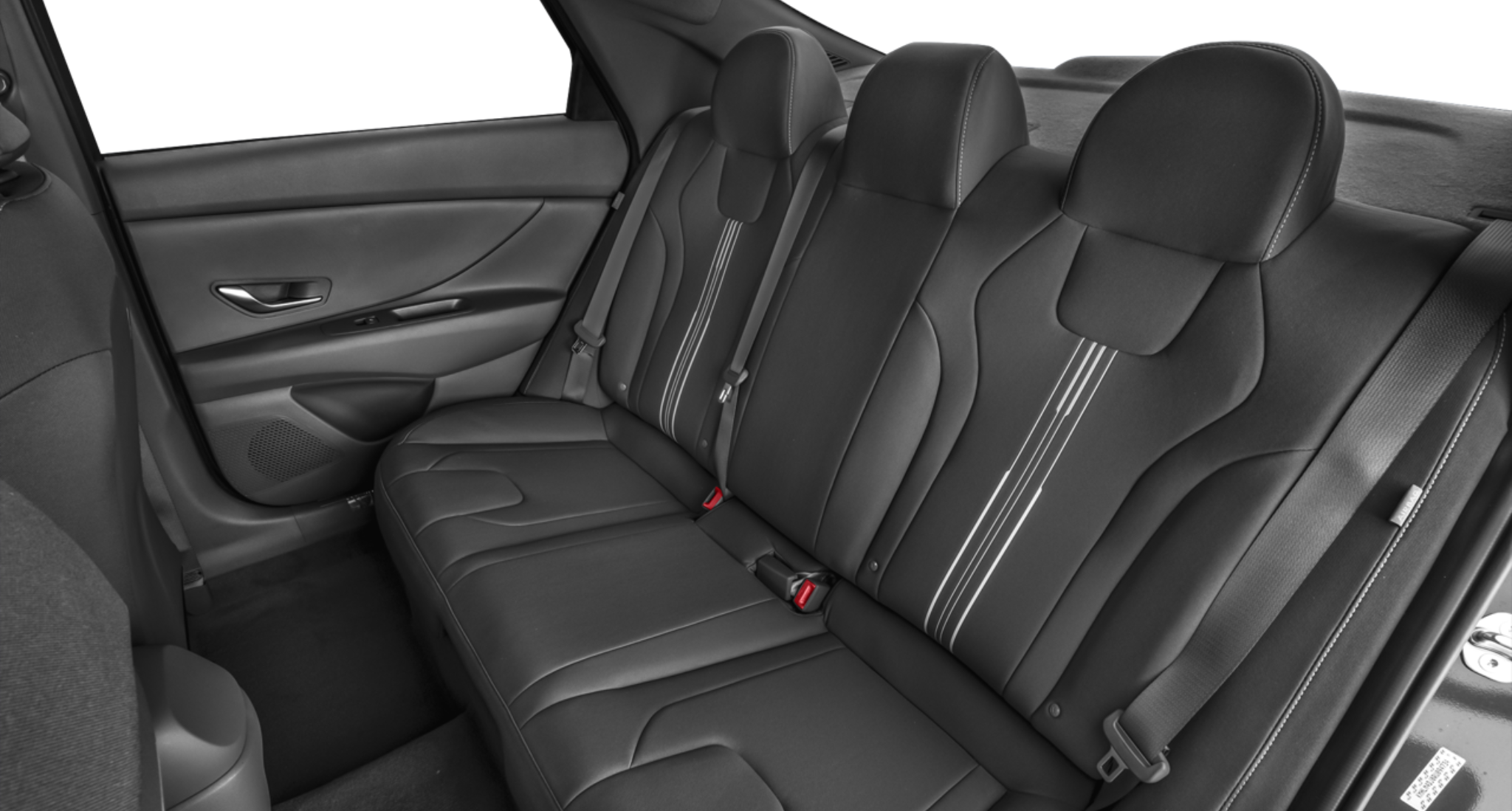 Interior rear seating of the 2025 Hyundai Elantra Hybrid Blue featuring black premium cloth seats with contrast stitching and spacious legroom.