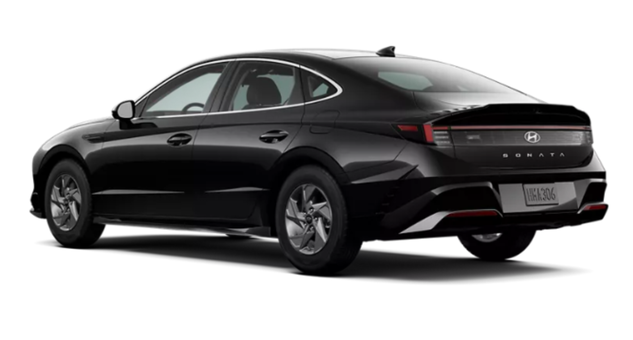 Rear view of the 2025 Hyundai Sonata SE in black, highlighting the LED taillights, sleek aerodynamic design, and bold rear bumper styling.
