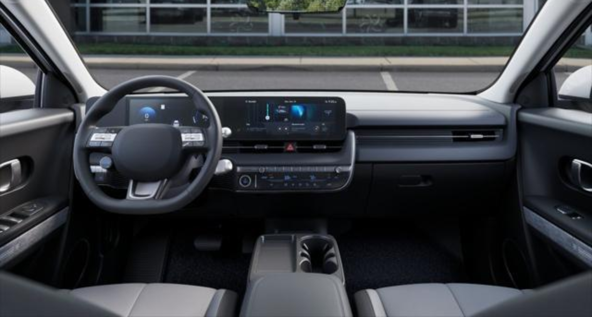 Modern interior dashboard of the 2025 Hyundai Ioniq-5 RWD SE showcasing the 12.3-inch digital instrument cluster, touchscreen infotainment system, and minimalist control layout.