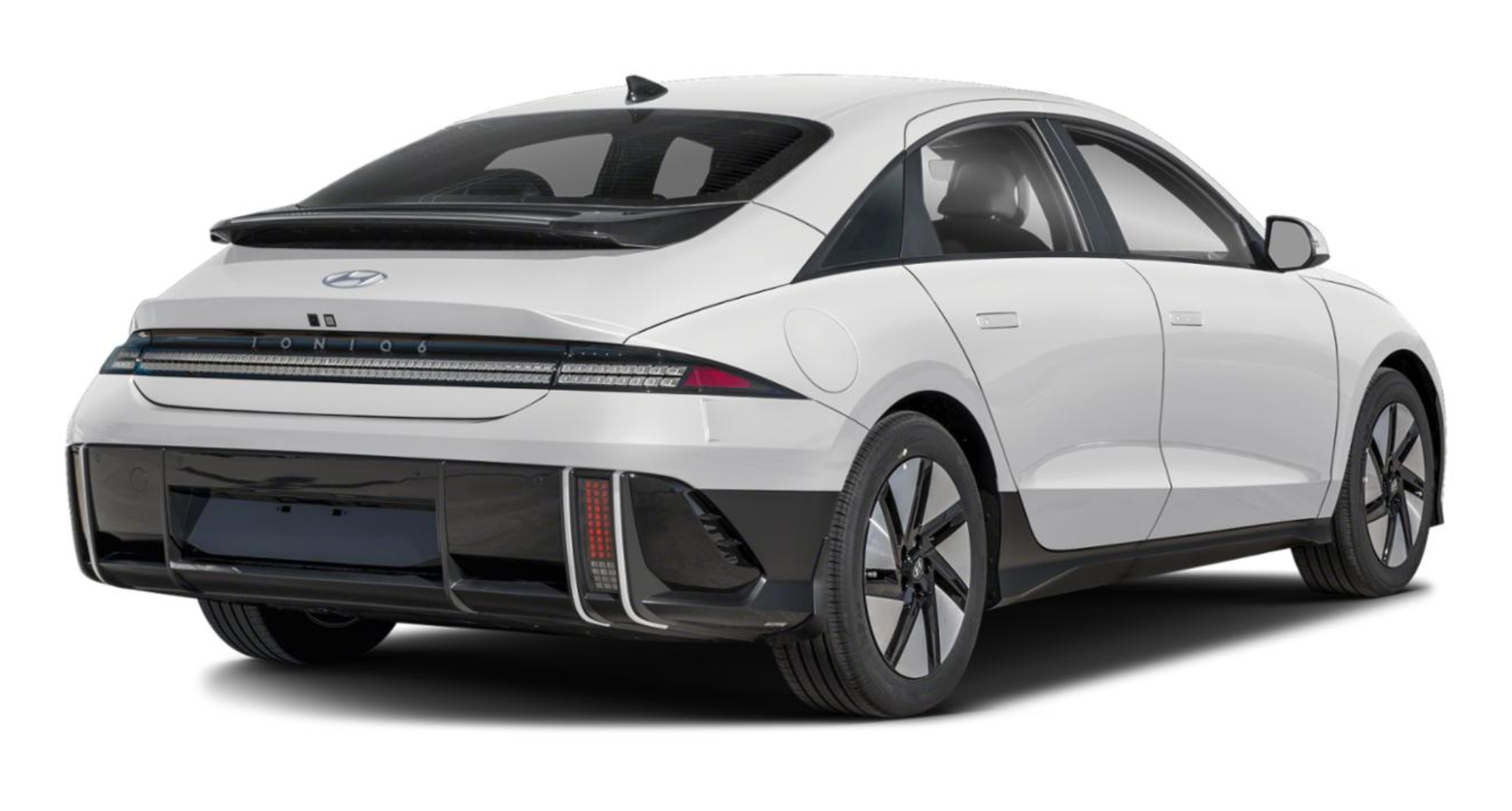 Rear view of the 2025 Hyundai IONIQ-6 RWD in white, showcasing its aerodynamic design, full-width LED tail lights, and sleek rear spoiler.