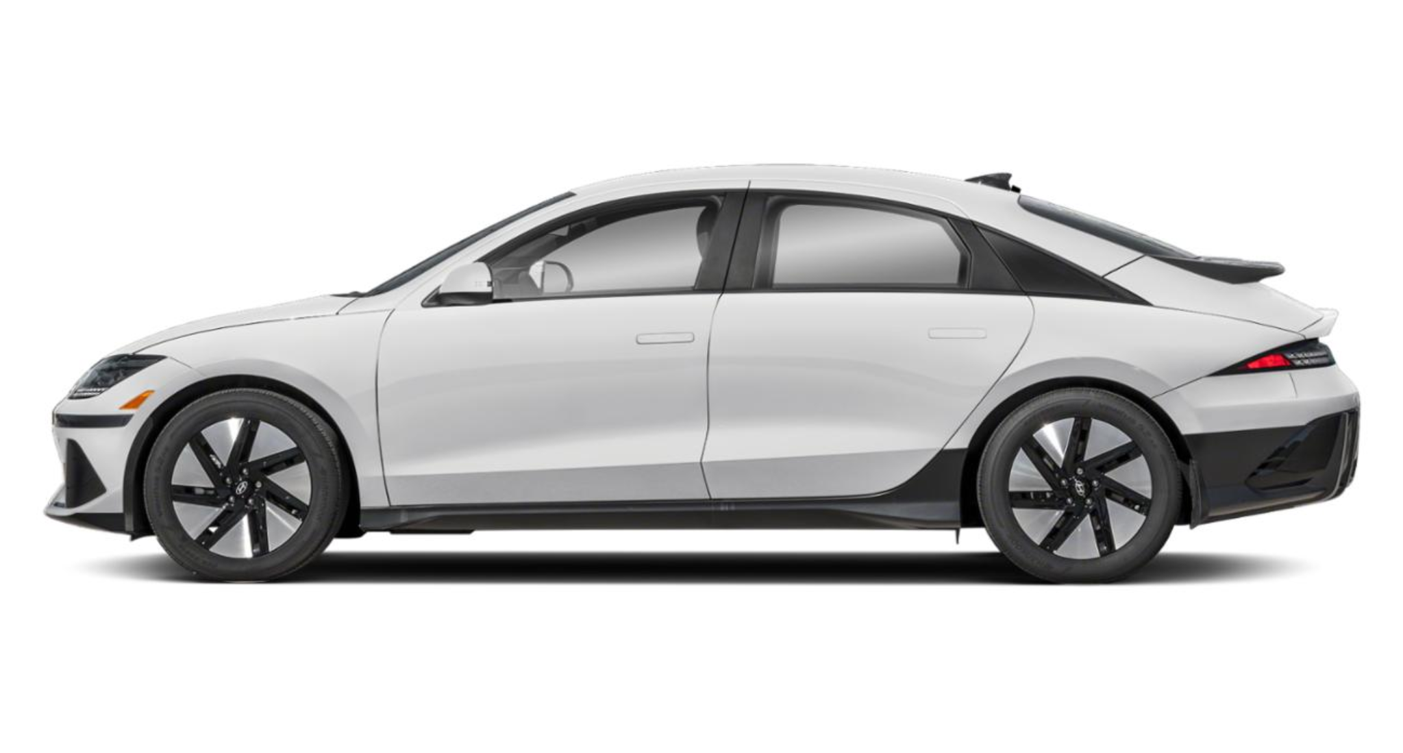 Side profile of the 2025 Hyundai IONIQ-6 RWD in white, highlighting its aerodynamic silhouette, flush door handles, and 18-inch alloy wheels.