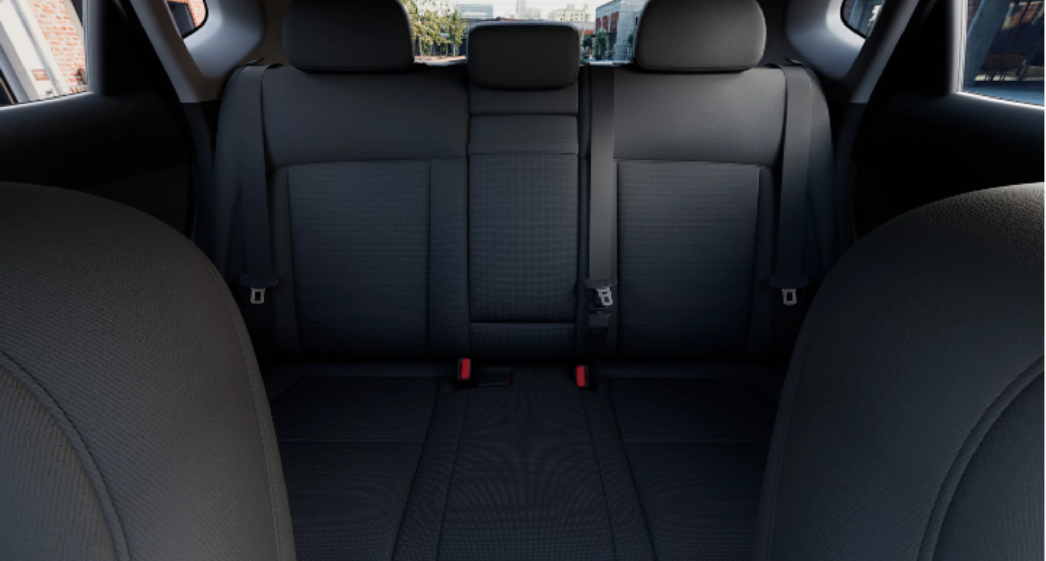 Rear seats of the 2025 Hyundai Kona SE featuring premium cloth upholstery, spacious seating for three passengers, and a 60/40 split-fold design for added cargo flexibility.