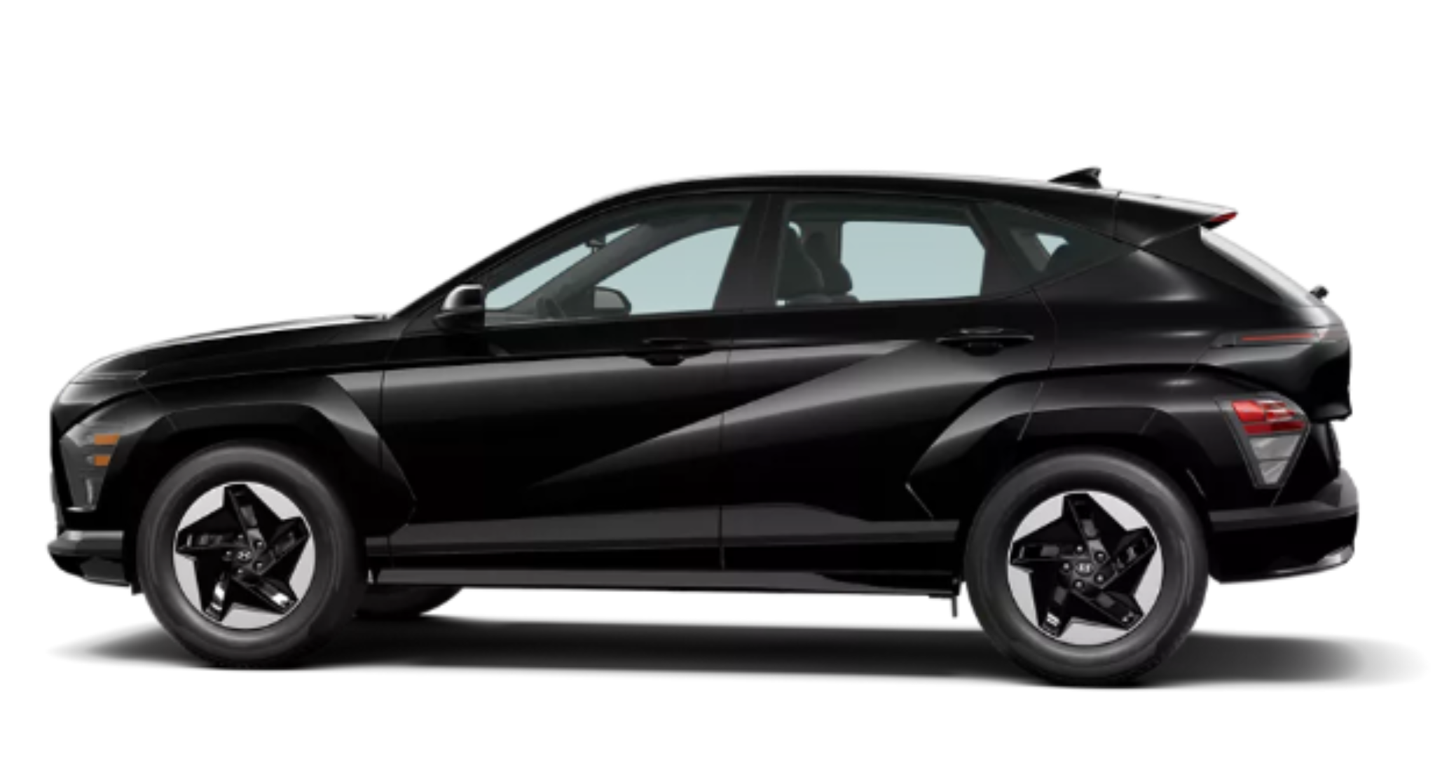 2025 Hyundai Kona Electric SE side profile in black, highlighting the SUV's aerodynamic design, sharp body lines, and 17-inch alloy wheels.