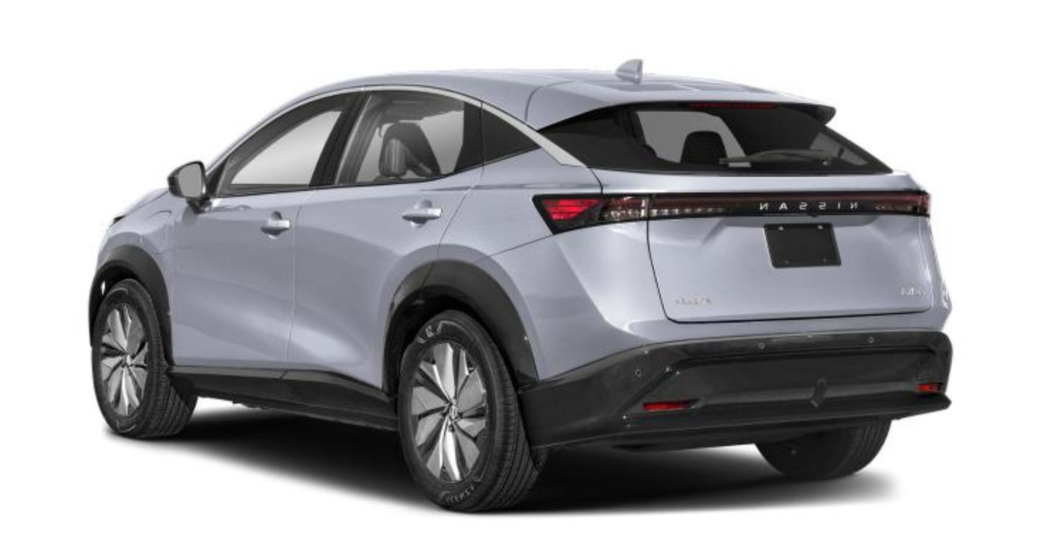 Rear exterior view of the 2025 Nissan Ariya Engage FWD in Boulder Gray Pearl, highlighting its LED taillights, sleek aerodynamic design, and sculpted rear bumper.
