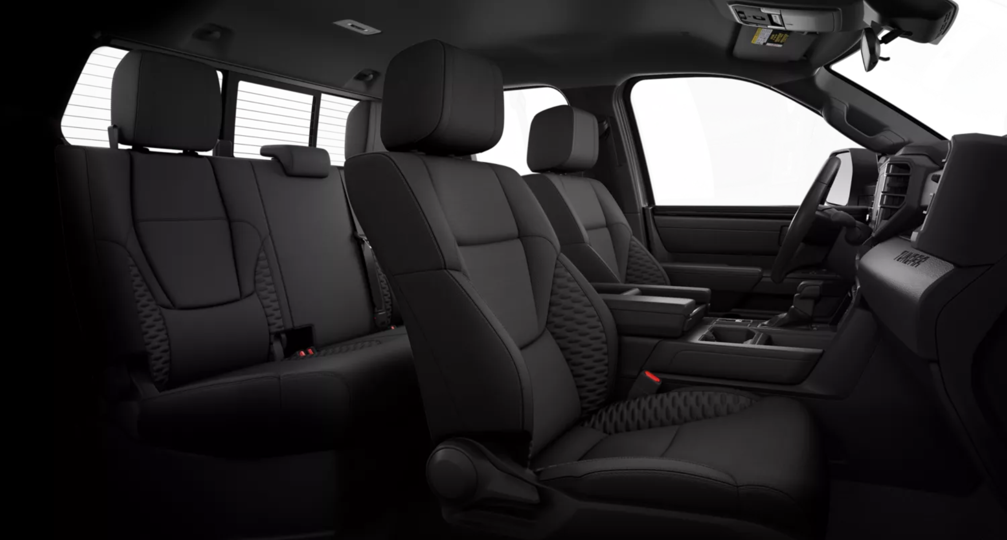 Spacious black fabric seats in the 2025 Toyota Tundra SR 4WD Double Cab with rear under-seat storage and rugged utility-focused design.