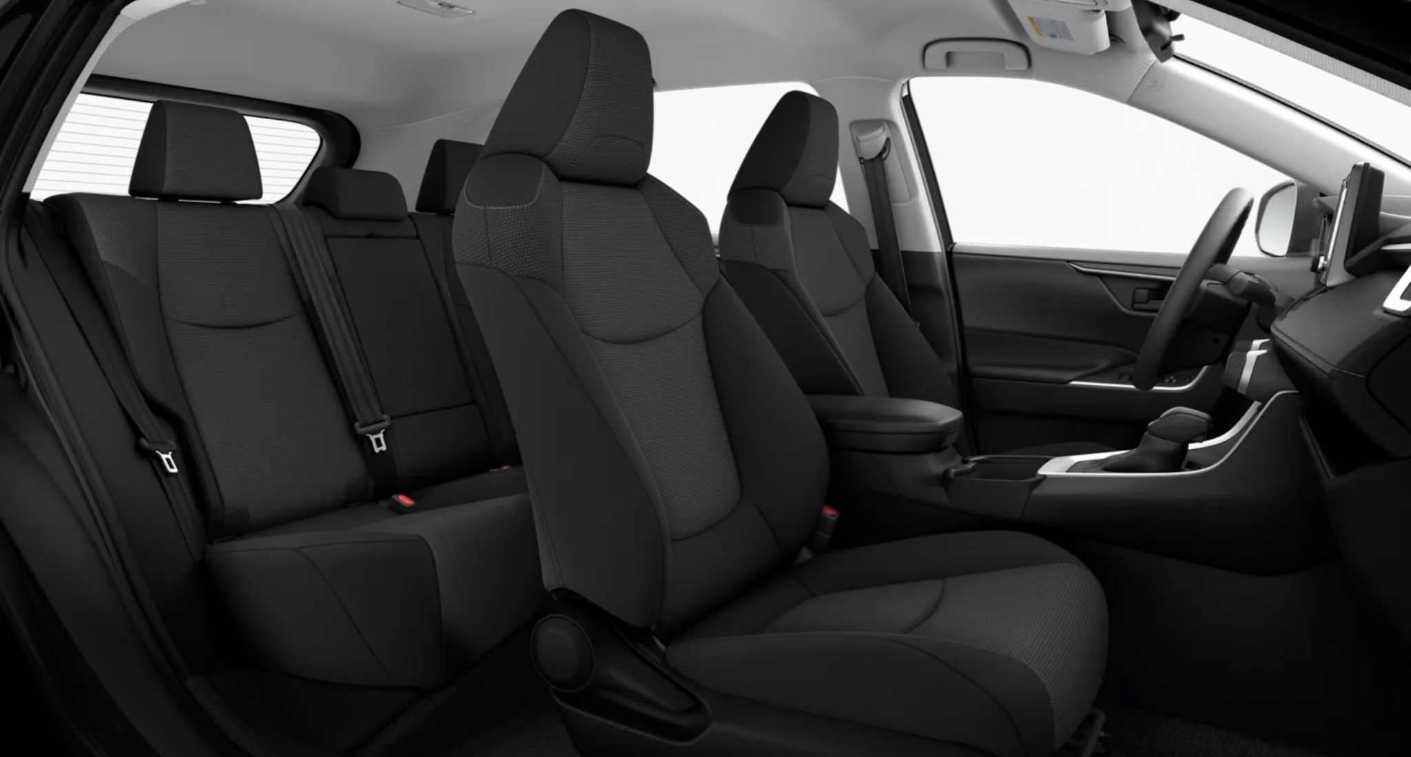 2025 Toyota RAV4 LE interior showcasing front and rear fabric-trimmed seats with spacious legroom and modern black upholstery.