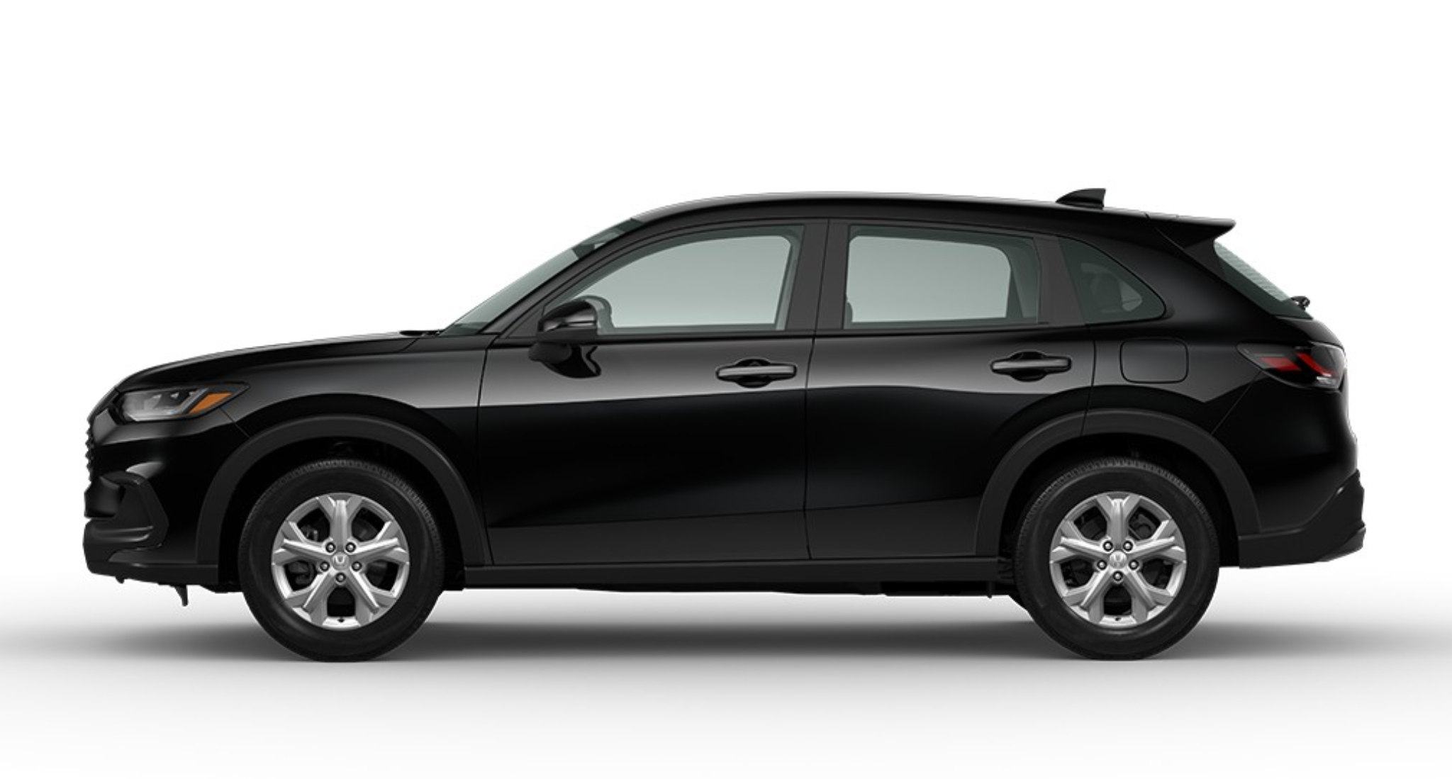 Side profile of the 2025 Honda HR-V AWD LX compact SUV in black, highlighting aerodynamic design, alloy wheels, and contoured body styling