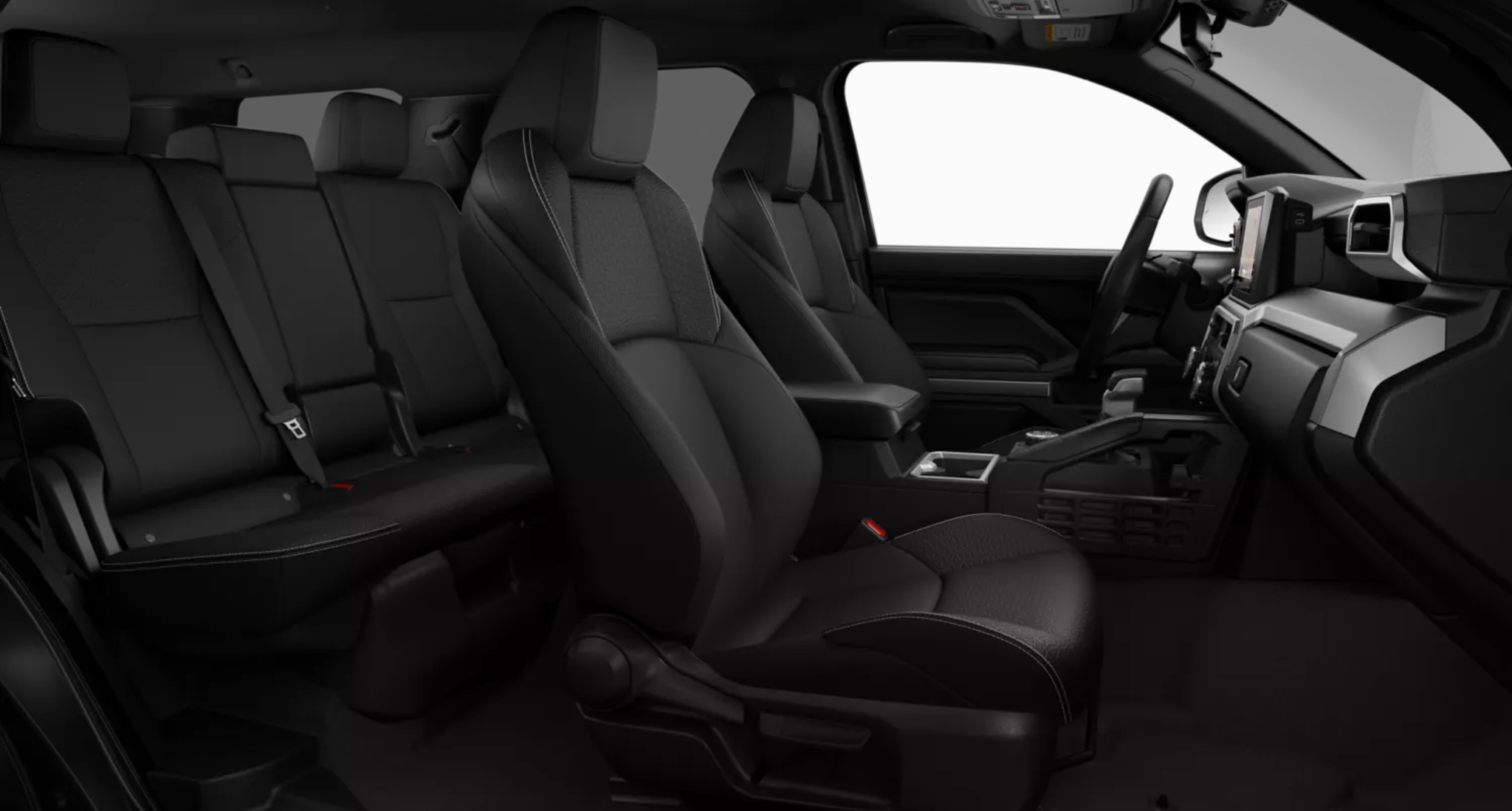 2025 Toyota 4Runner SR5 4WD interior with black fabric-trimmed front and rear seats, offering spacious and comfortable cabin layout for up to five passengers.