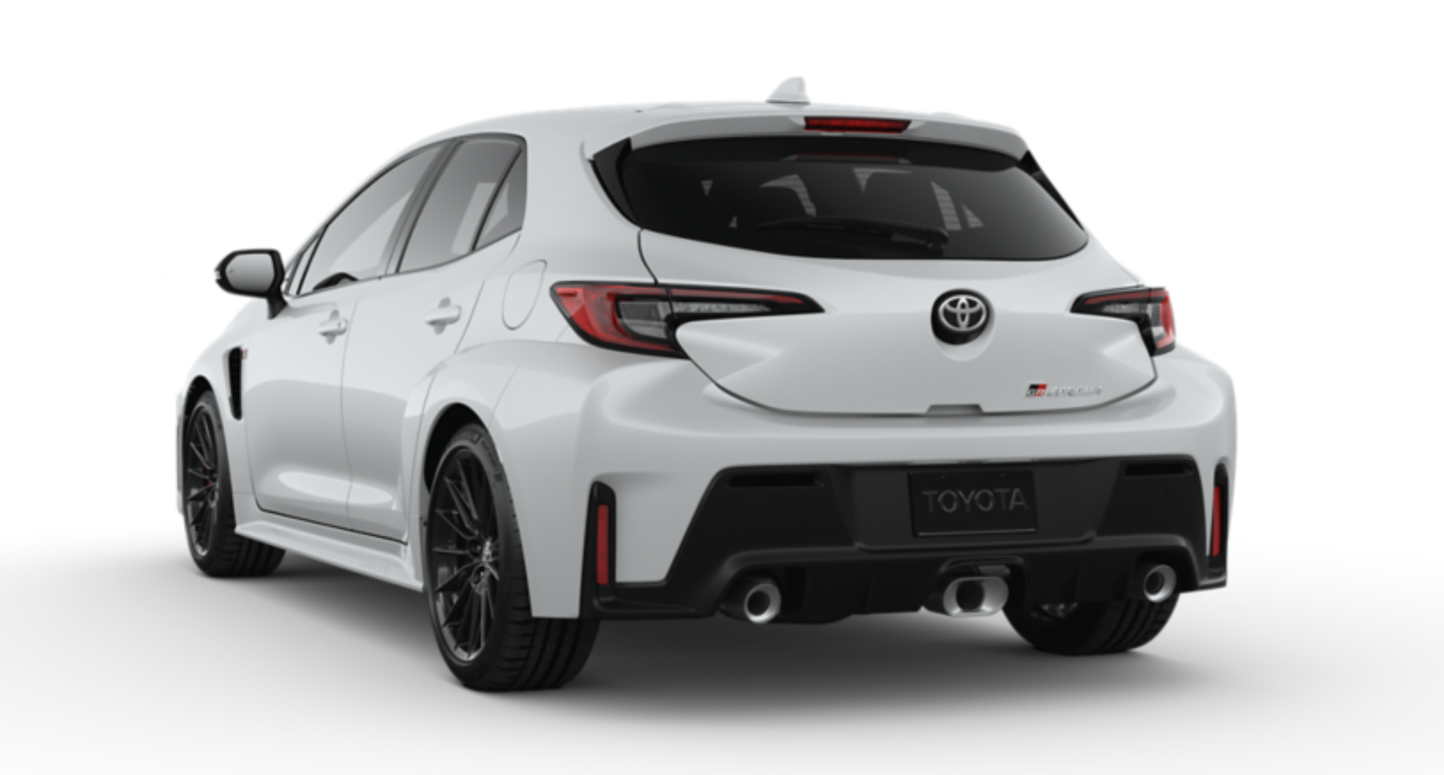 2025 Toyota GR Corolla Core Trim AWD rear view highlighting the dual chrome exhaust, color-keyed rear spoiler, LED taillights, and wide fender flares enhancing its rally-inspired stance.