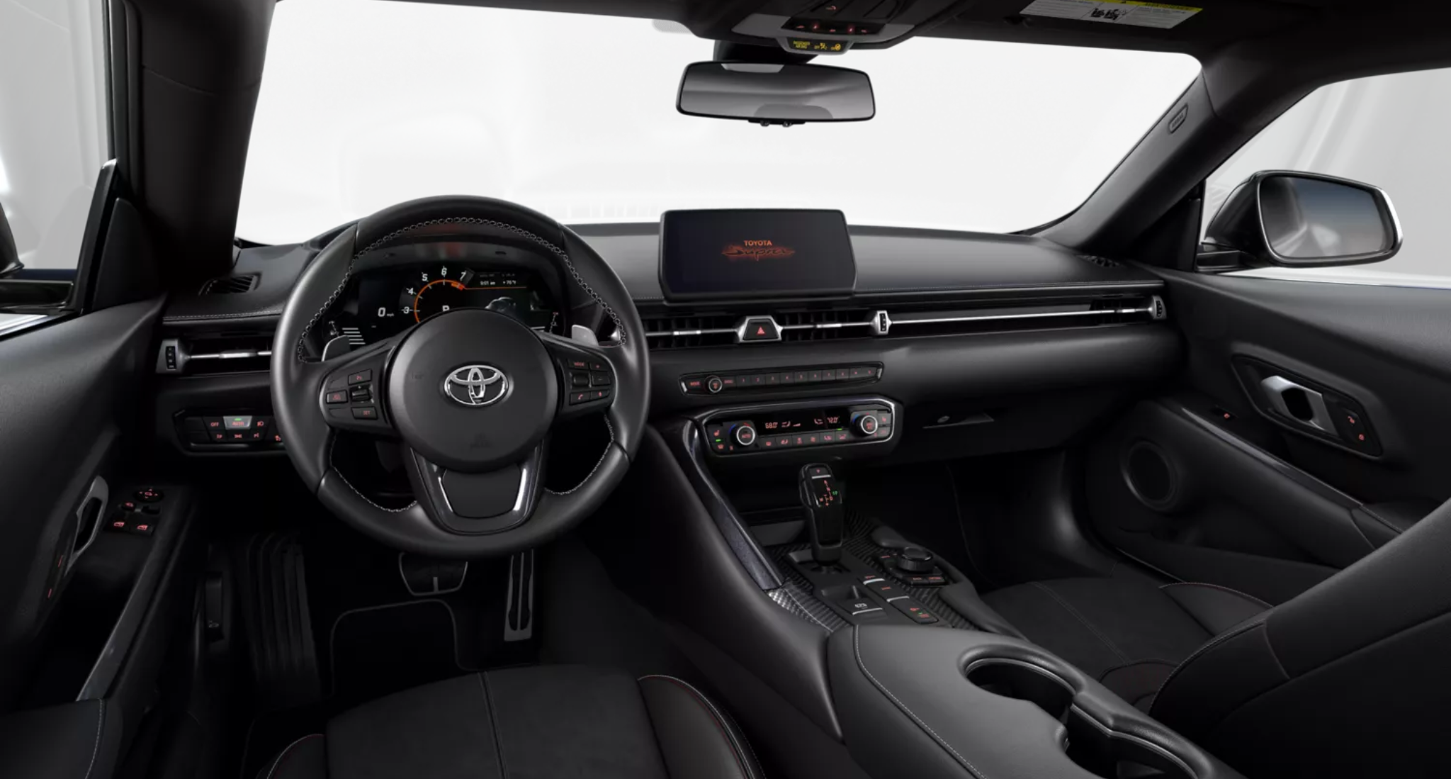 2025 Toyota GR Supra 3.0 RWD cockpit view highlighting the leather-wrapped steering wheel, digital instrument cluster, and 8.8-inch touchscreen display.