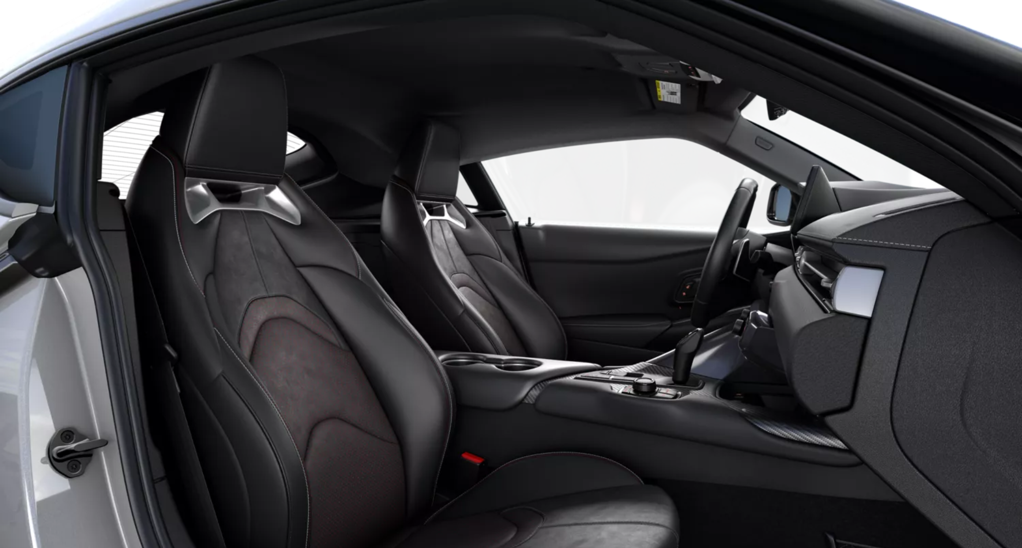 2025 Toyota GR Supra 3.0 RWD interior view showcasing Alcantara and leather-trimmed sport seats with driver memory and heated seating.