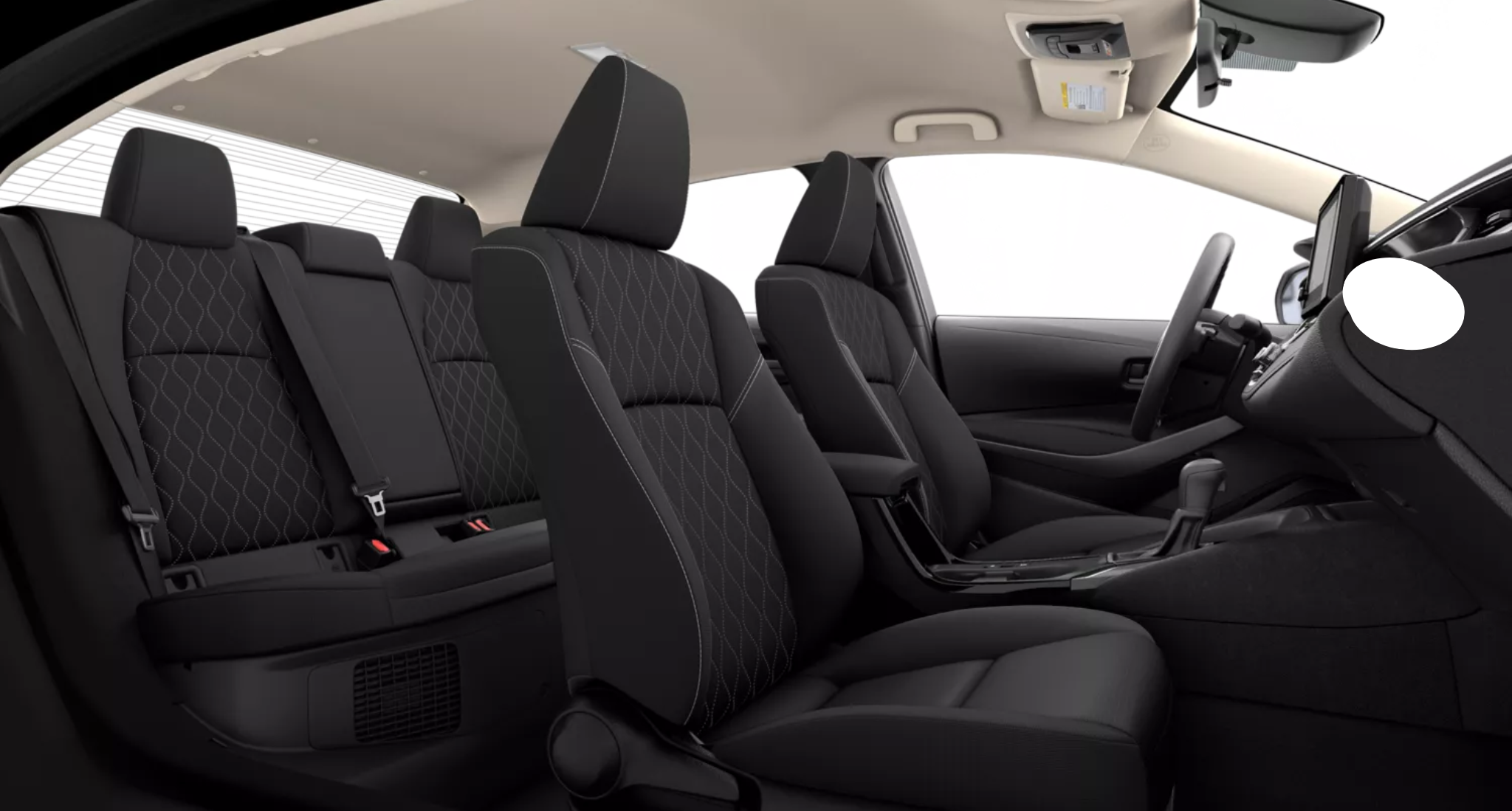 Spacious and modern interior of the 2025 Toyota Corolla Hybrid LE, featuring black fabric seats with diamond-pattern stitching, ergonomic front seats, and a versatile 60/40 split rear seat design for added cargo space.