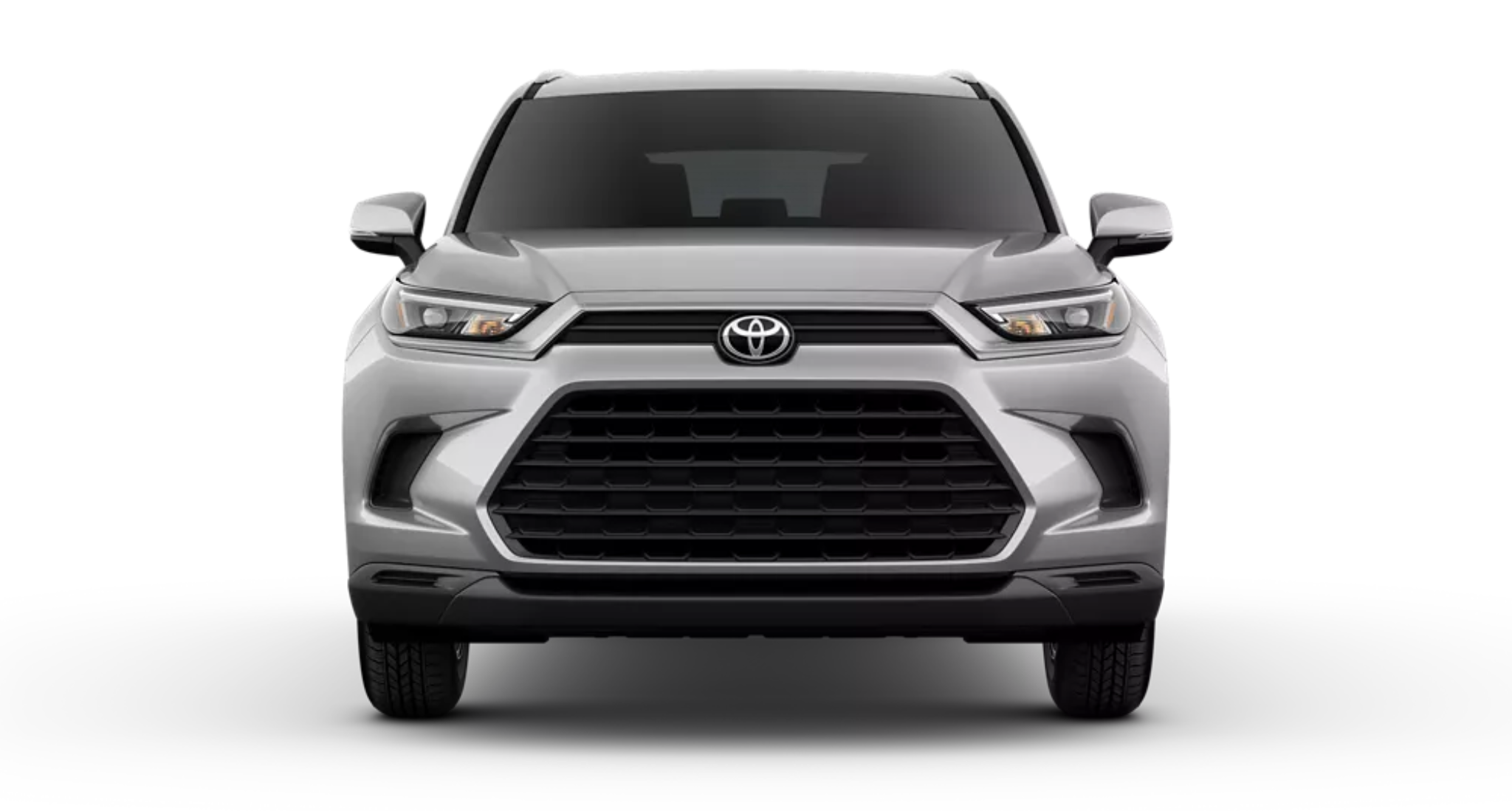 Front exterior view of the 2025 Toyota Grand Highlander LE highlighting its bold grille design, LED headlights, and aerodynamic SUV styling.