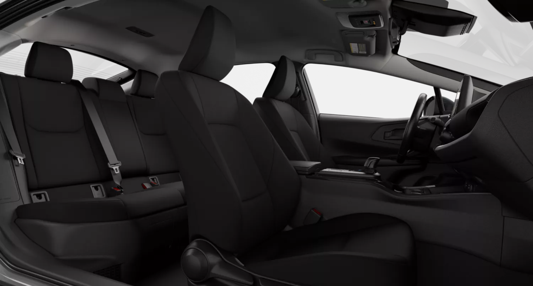 Interior view of the 2025 Toyota Prius Hybrid LE showcasing spacious black fabric-trimmed front and rear seats with a modern, minimalist design.