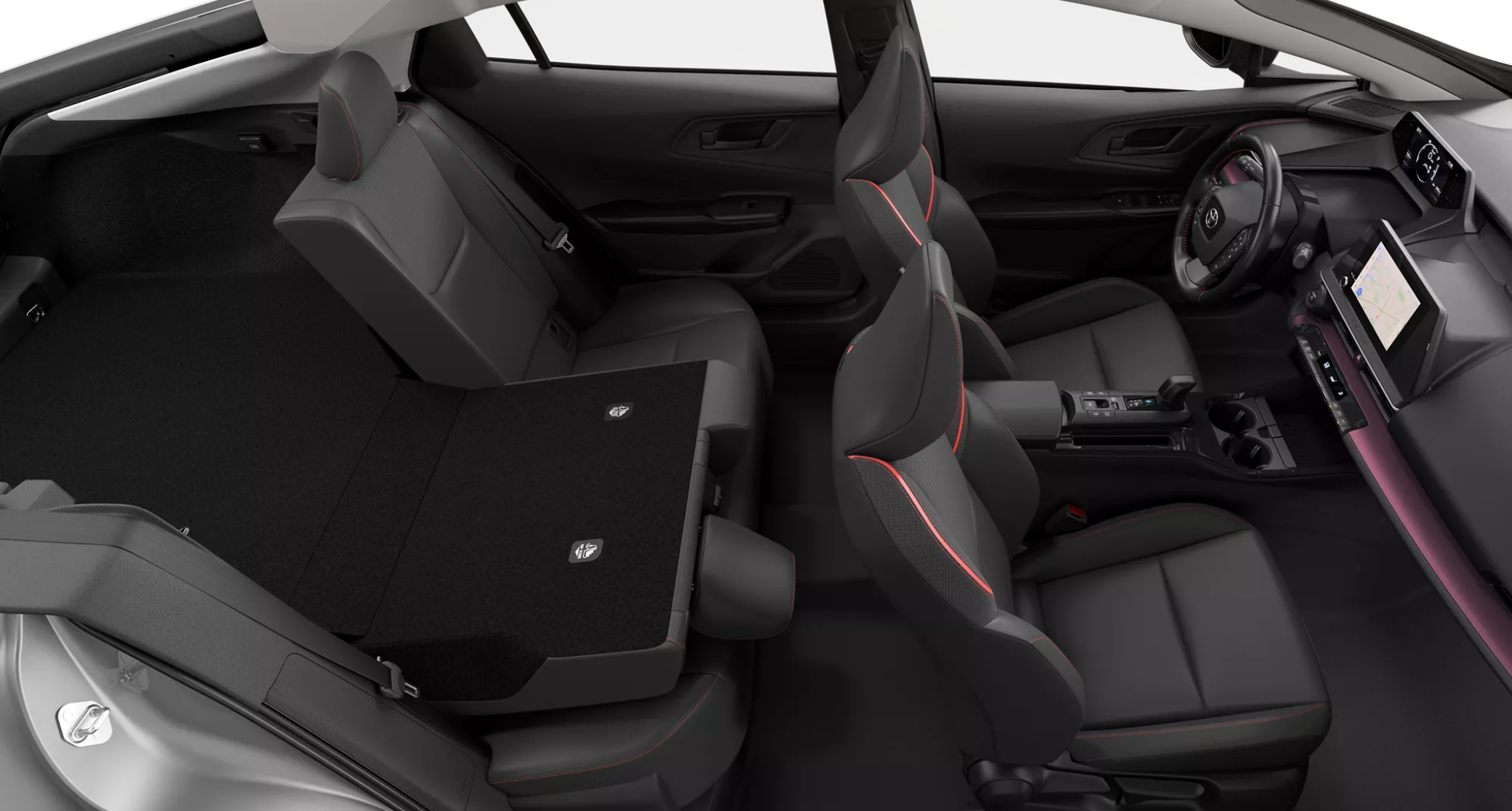 Interior view of the 2025 Toyota Prius PHEV LE showing rear seats folded flat, highlighting the spacious cargo area and versatile seating configuration.