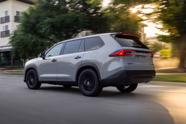 Rear view of the 2025 Toyota Grand Highlander Hybrid, highlighting its spacious hybrid design for families