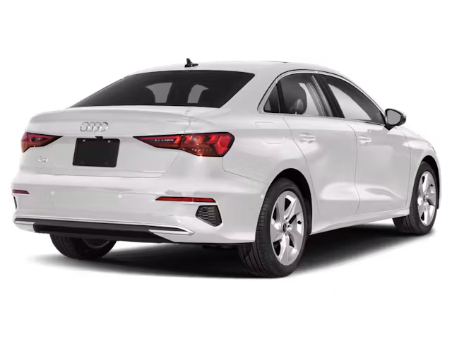 Rear view of the 2025 Audi A3 in red, showcasing its sleek design, LED taillights, and aerodynamic styling. A premium compact sedan with quattro AWD.