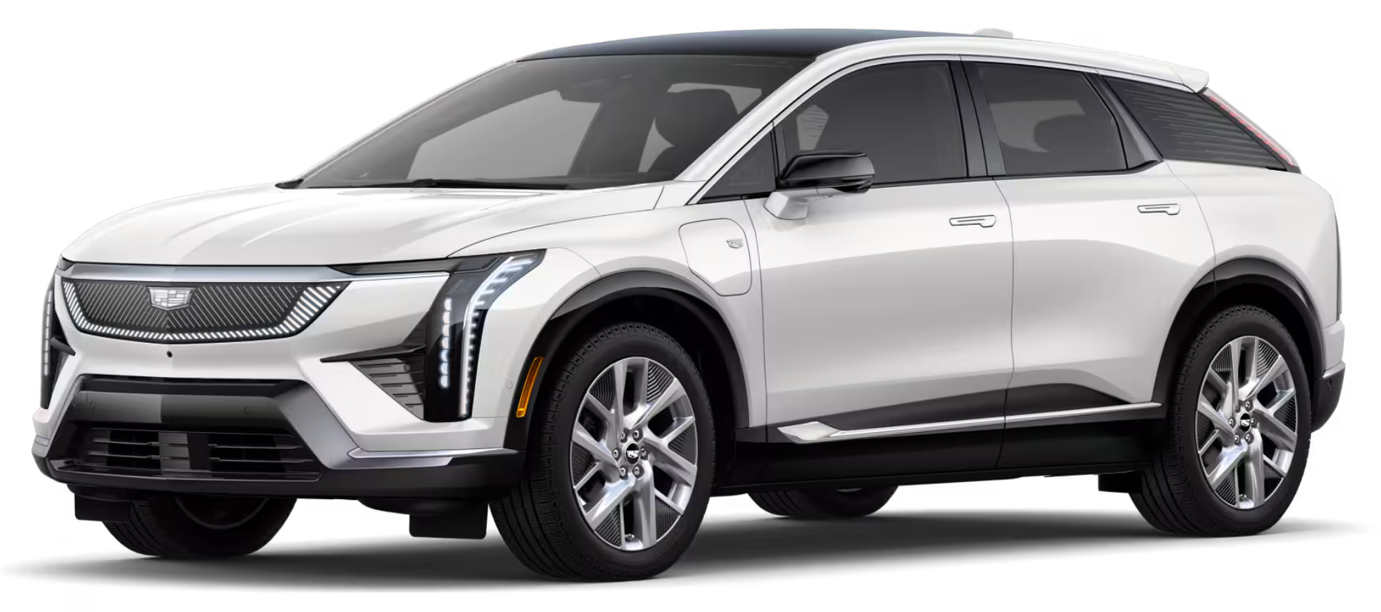2025 Cadillac Optiq Luxury AWD EV front exterior view highlighting illuminated grille, sleek headlights, and aerodynamic design.