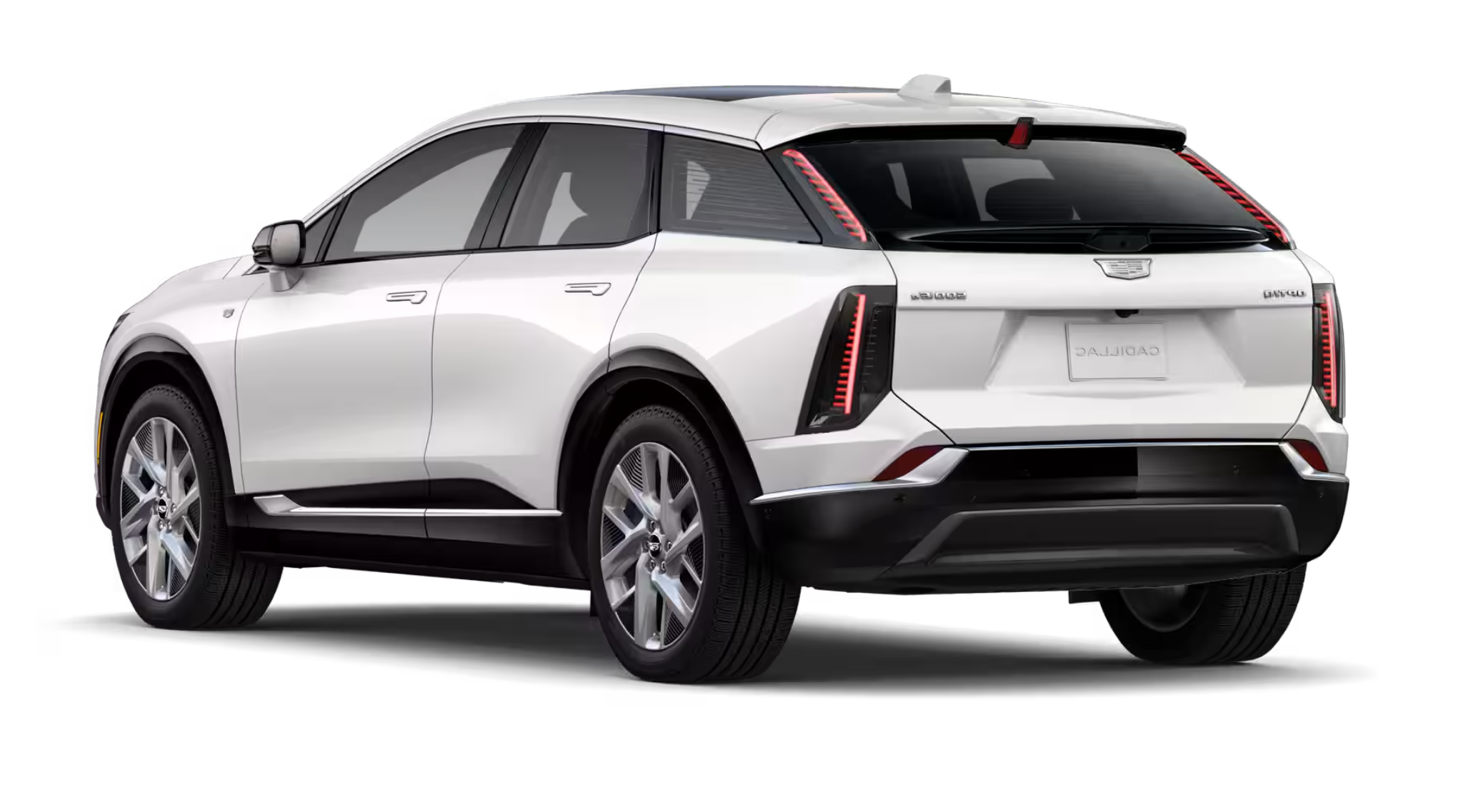 2025 Cadillac Optiq Luxury AWD EV rear view showcasing LED taillights, stylish rear spoiler, and modern electric SUV design.