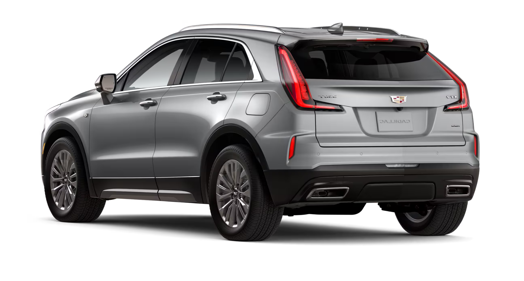 Rear exterior view of the 2025 Cadillac XT4 Premium Luxury AWD emphasizing its LED tail lamps, dual exhaust outlets, and sculpted rear design.