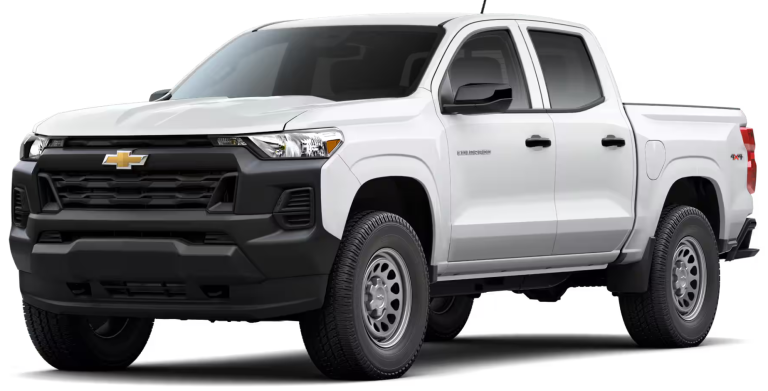 Front angle of the 2025 Chevrolet Colorado WT 4WD showing rugged grille, black bumper, LED headlights, and muscular stance.