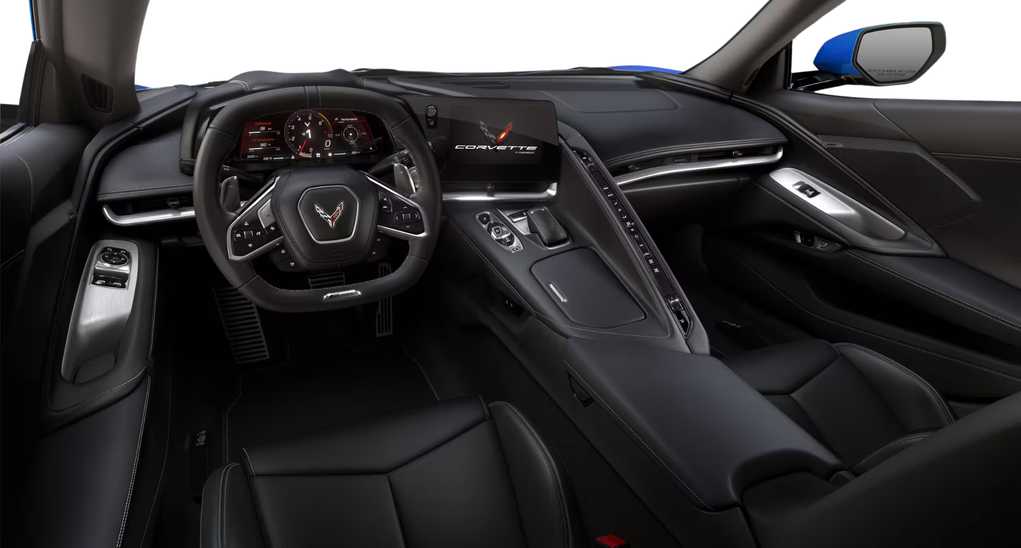 Driver-focused cockpit of the 2025 Corvette E-Ray AWD showing the digital gauge cluster, infotainment display, and flat-bottom steering wheel.