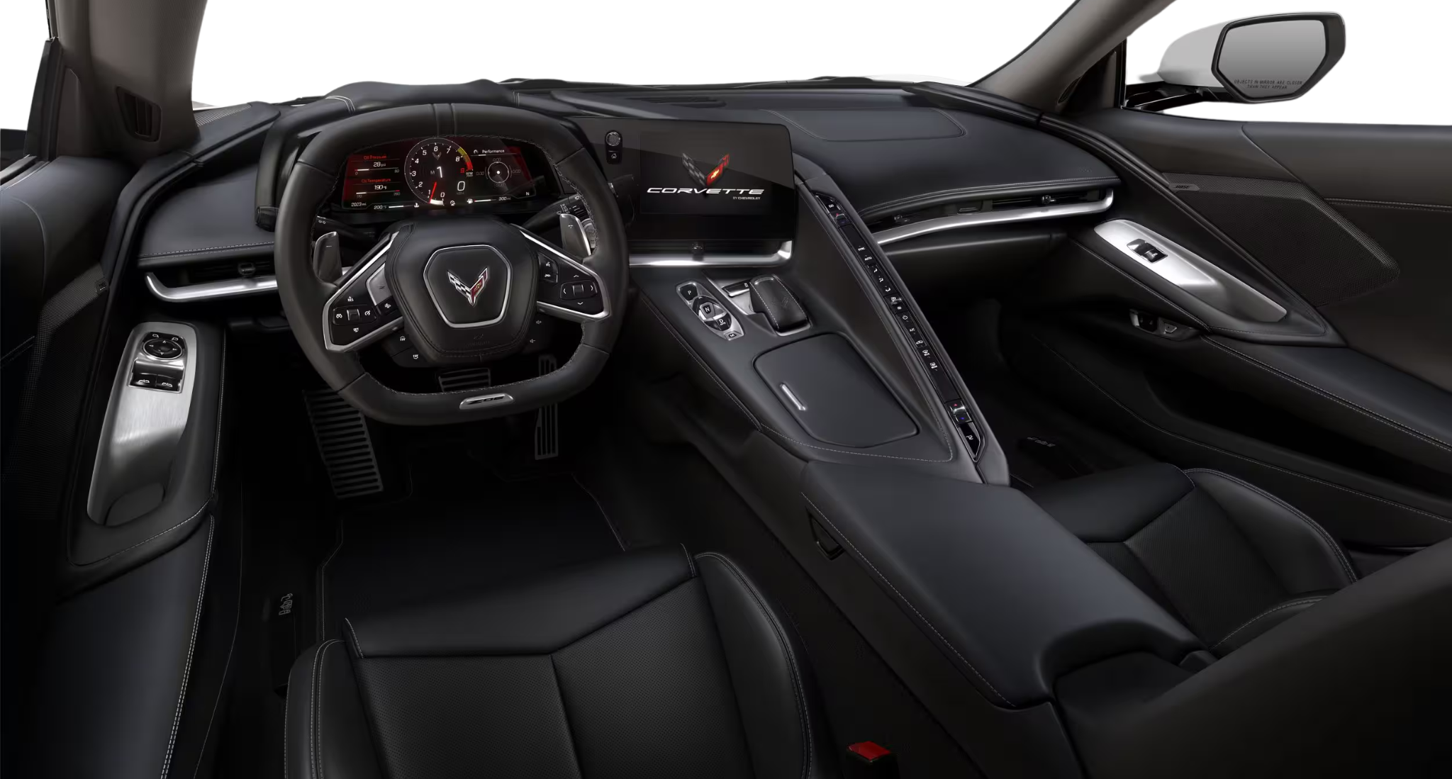 Interior view of 2025 Corvette Z06 showing driver cockpit, digital gauge cluster, and touchscreen infotainment system