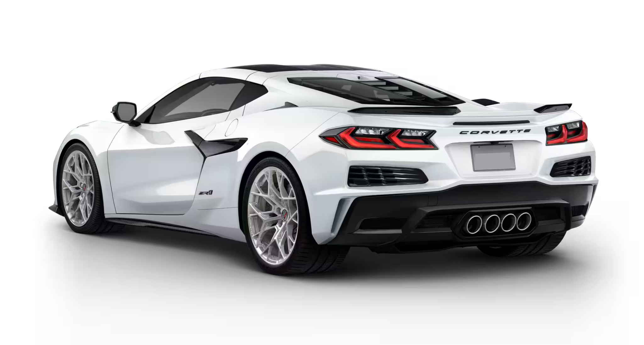 2025 Chevrolet Corvette ZR1 RWD in Arctic White shown from rear angle with quad exhaust and carbon rear diffuser.