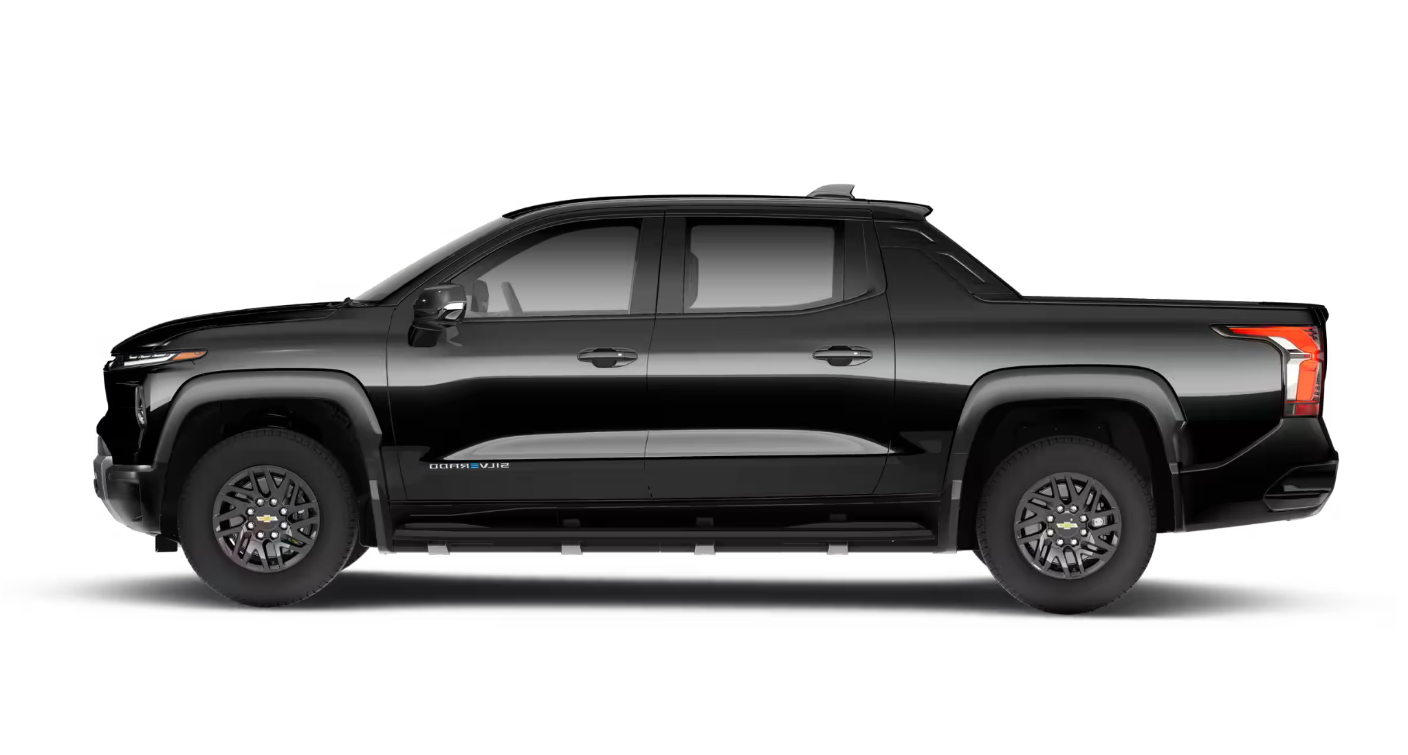 Side profile of the 2025 Chevrolet Silverado EV LT 4WD in black with aerodynamic lines and rugged stance