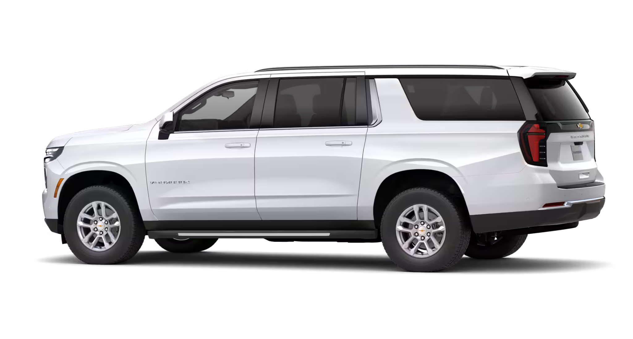 Side profile of the 2025 Chevrolet Suburban LS 4WD in white, highlighting its extended body, roof rails, and large windows.