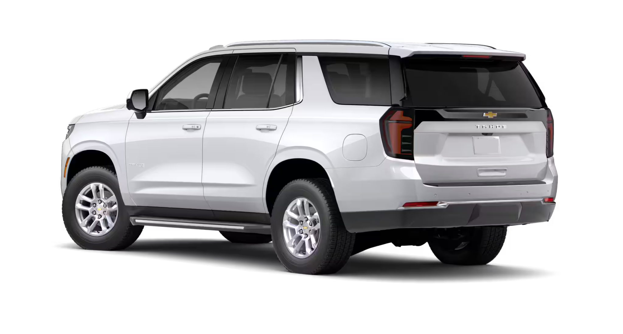 2025 Chevrolet Tahoe 4WD rear profile in white finish, featuring LED tail lamps, bold styling, and signature Chevrolet branding.