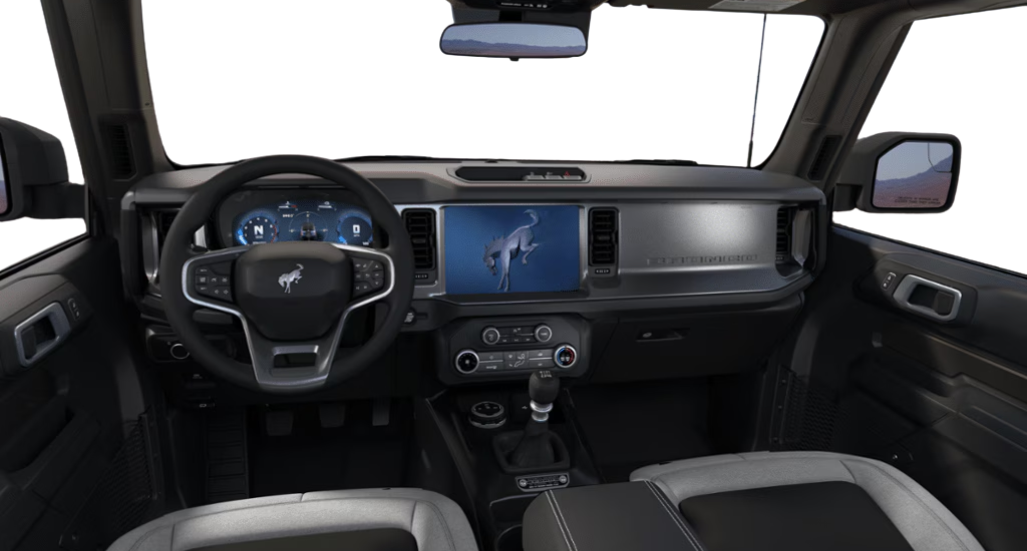 Interior view of the 2025 Ford Bronco Base 4x4 dashboard featuring SYNC® 4 touchscreen, digital gauge cluster, and manual shifter