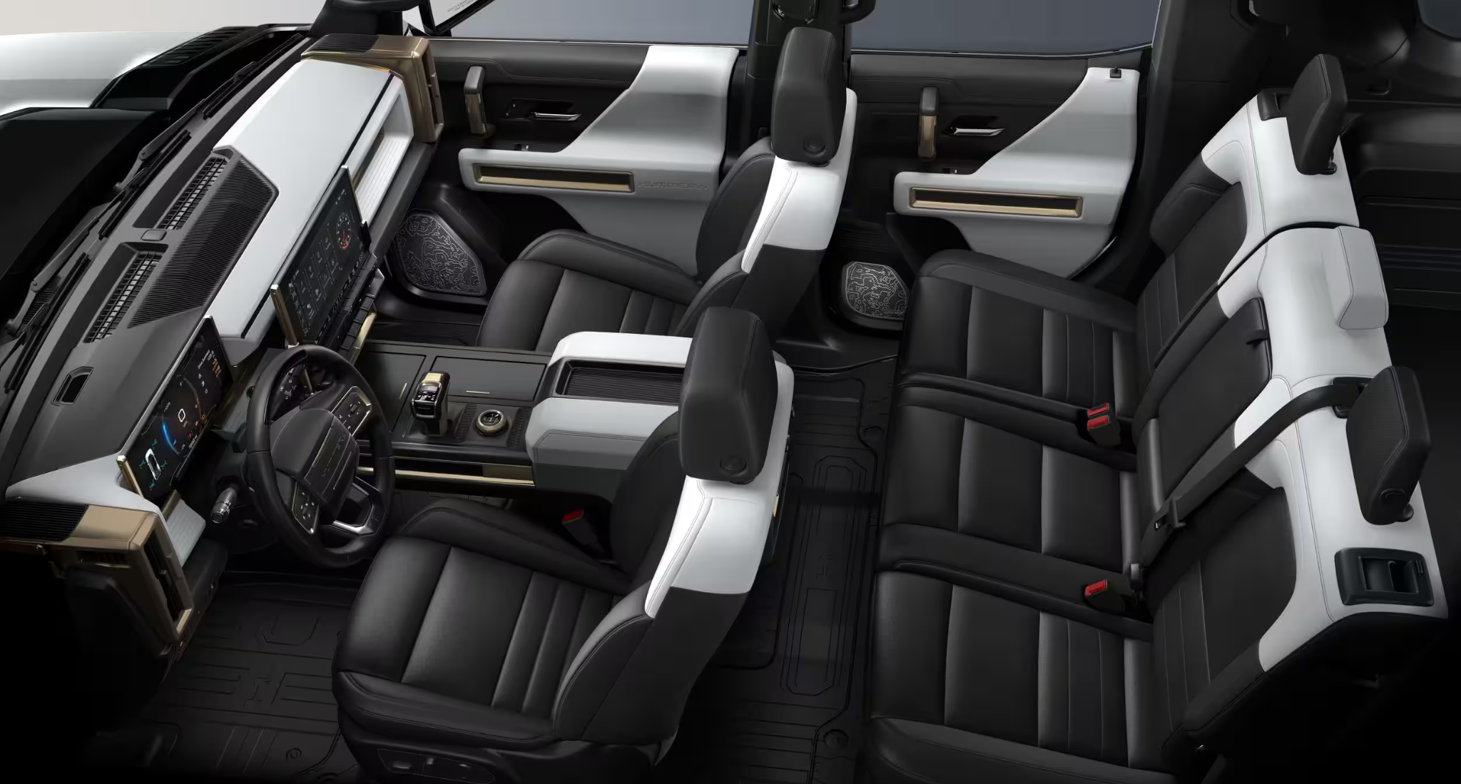 2025 GMC Hummer EV SUV interior showcasing premium black and white leather seats with spacious three-row cabin layout.