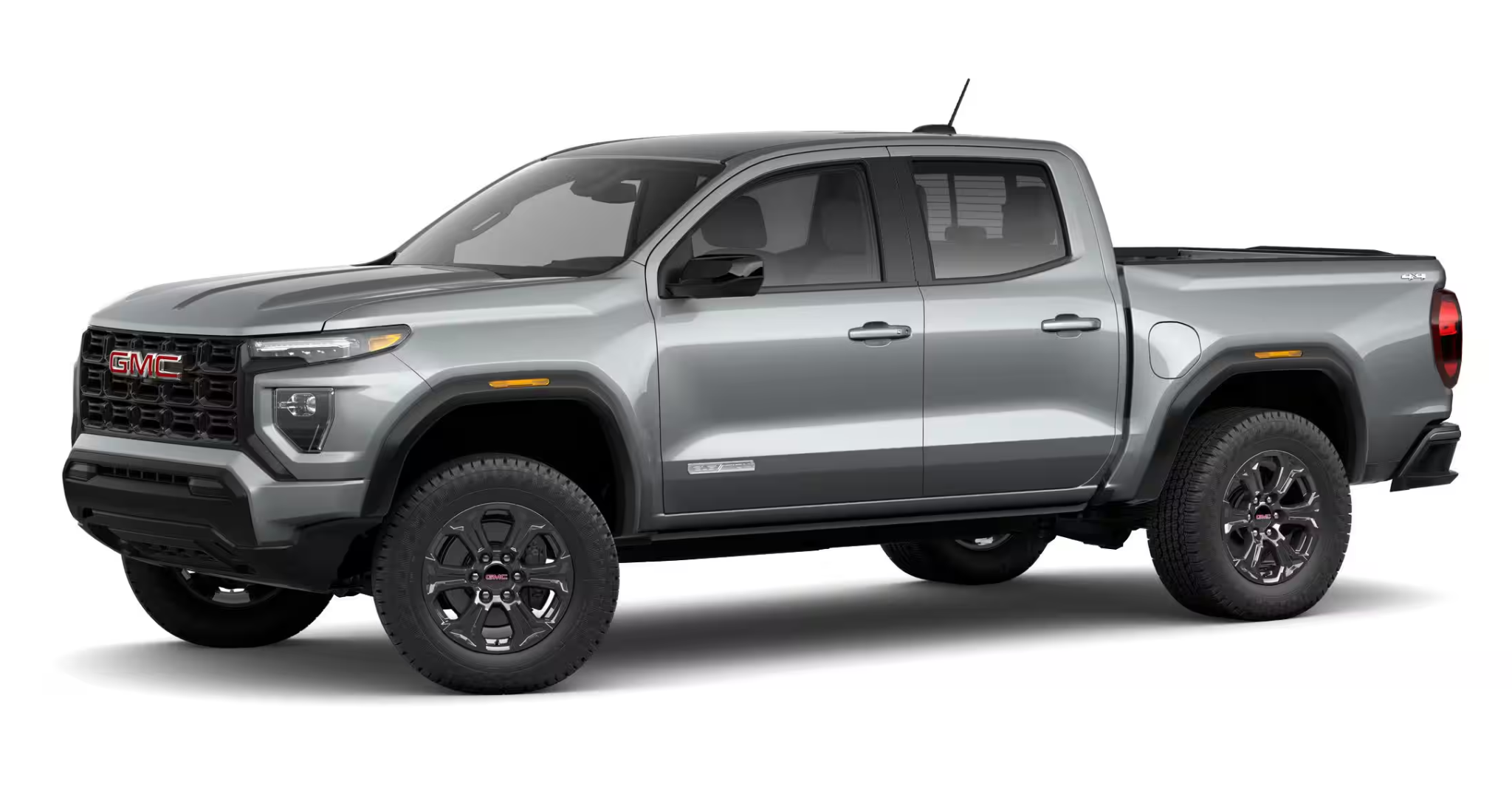Side profile of the 2025 GMC Canyon Elevation 4X4 with dark wheels, bold fender design, and rugged all-terrain stance.