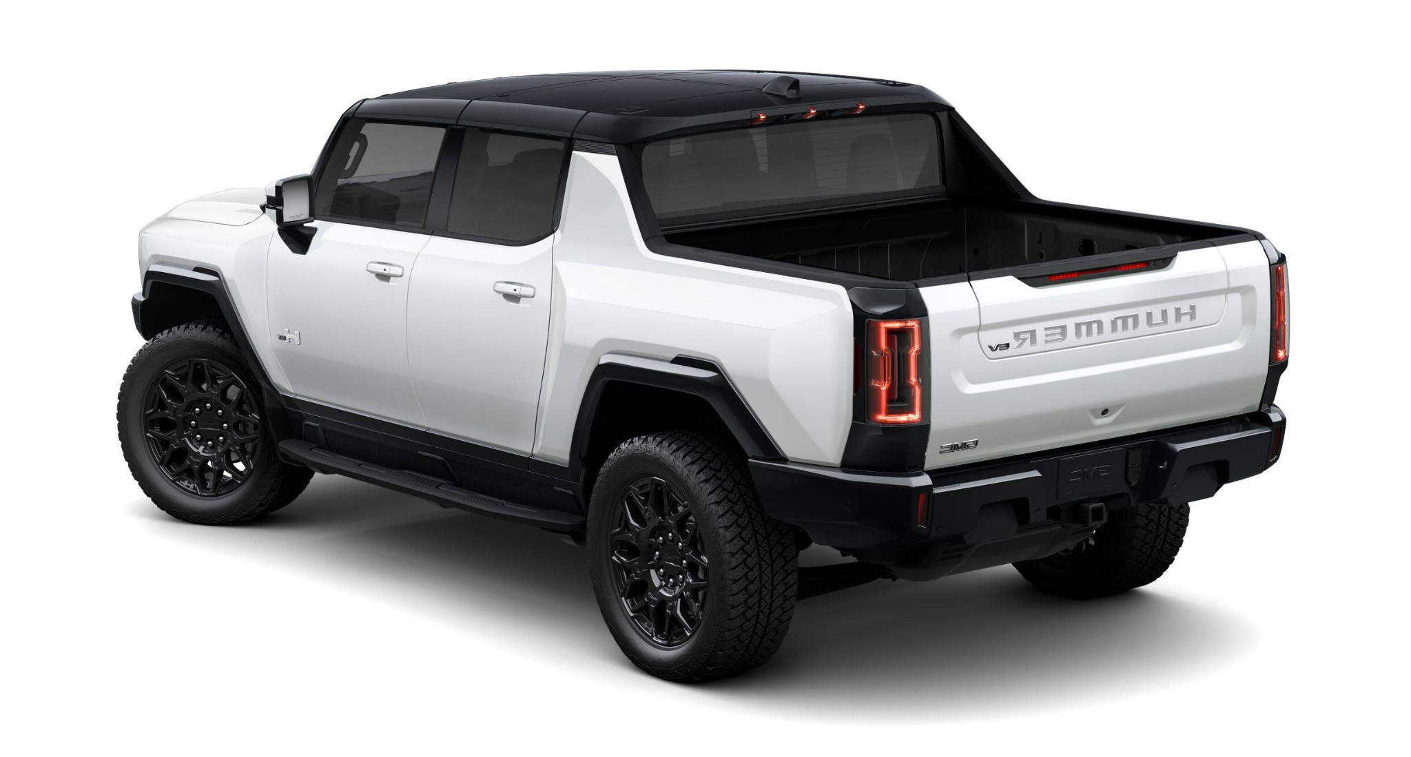 Rear angle of the 2025 GMC Hummer EV Pickup in white with black accents, showcasing LED taillights and rugged off-road styling.