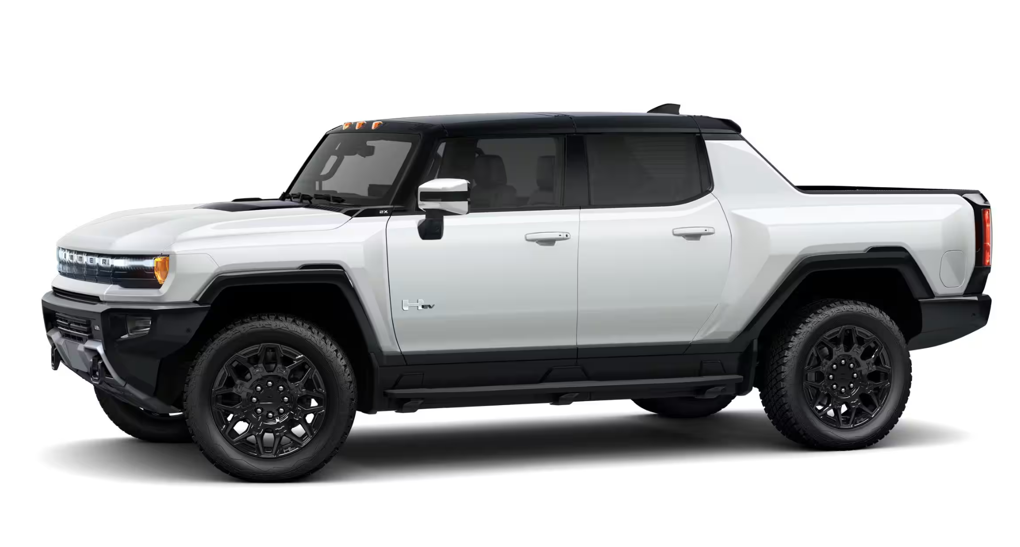Side profile of the 2025 GMC Hummer EV Pickup in white, highlighting its bold stance, large wheels, and futuristic electric design.