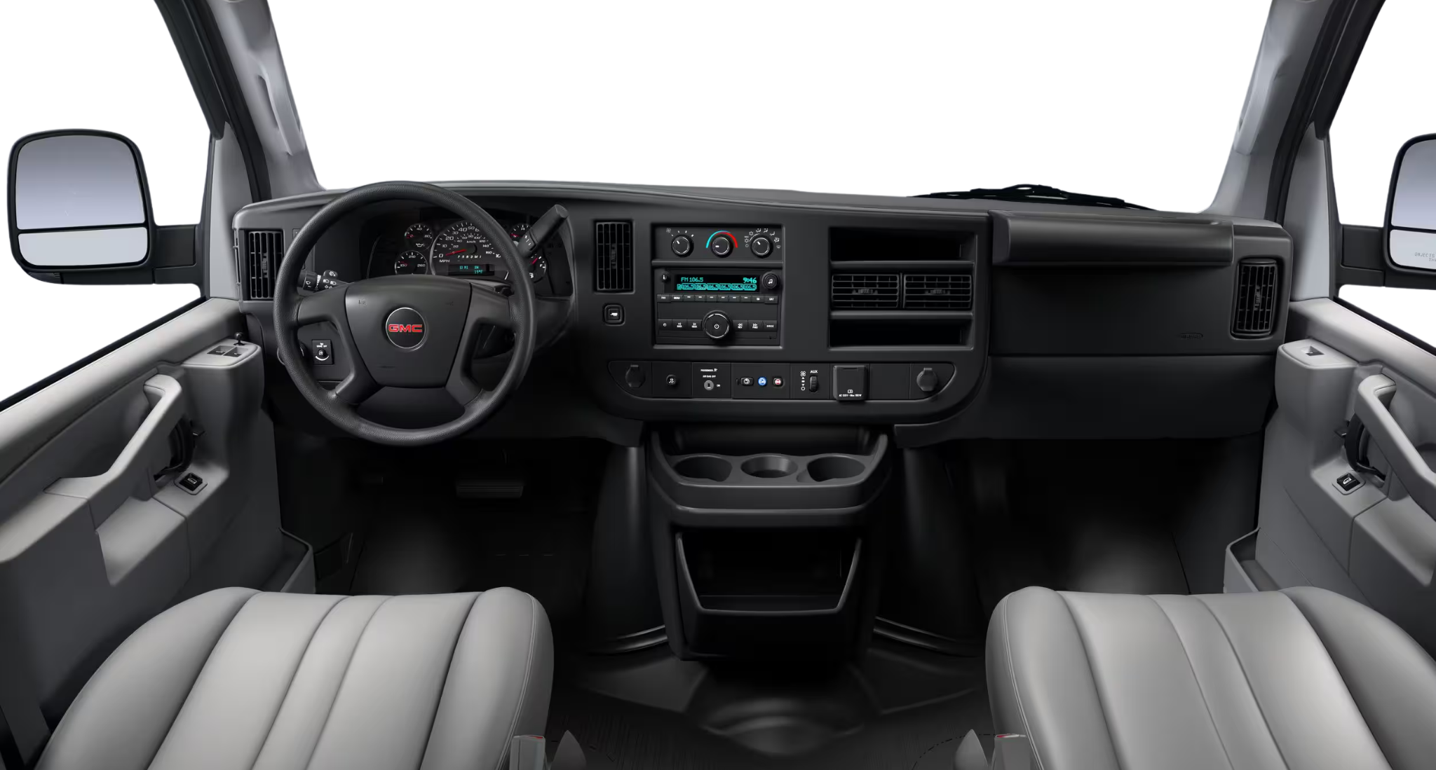 2025 GMC Savanna Passenger LS RWD dashboard view featuring the driver information center, AM/FM stereo, and vinyl front seats with armrests