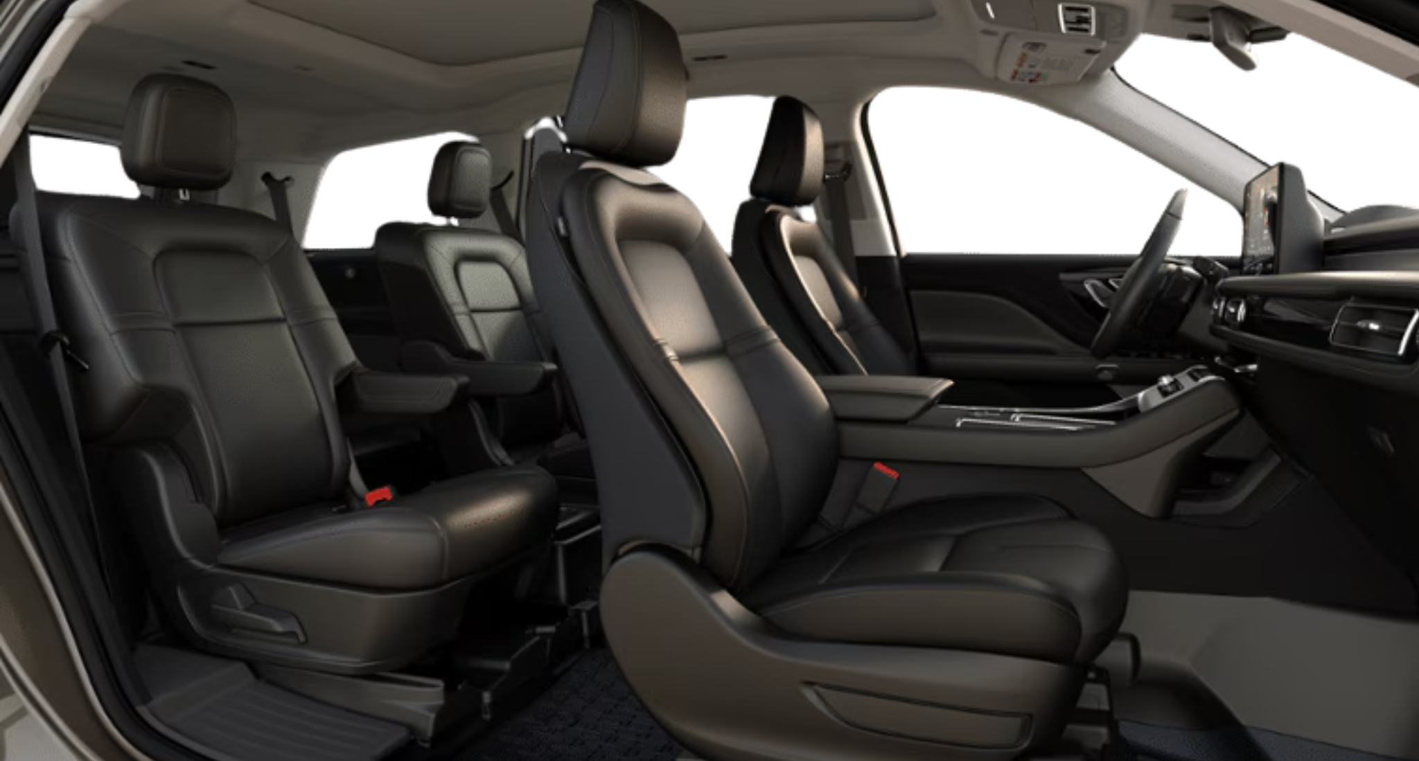 Spacious interior of the 2025 Lincoln Aviator Premiere AWD showing premium black leather captain’s chairs in the first and second rows with panoramic roof.