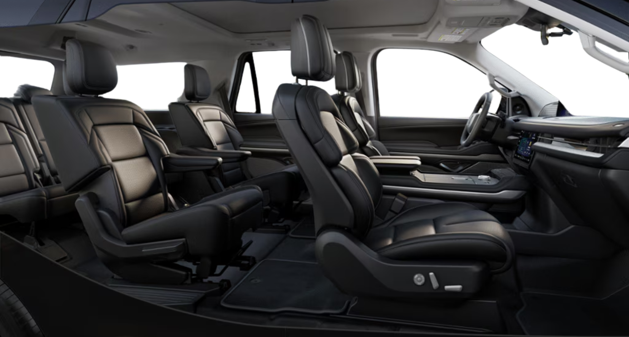 Spacious interior of the 2025 Lincoln Navigator Reserve 4X4 showcasing premium leather captain’s chairs across three rows.