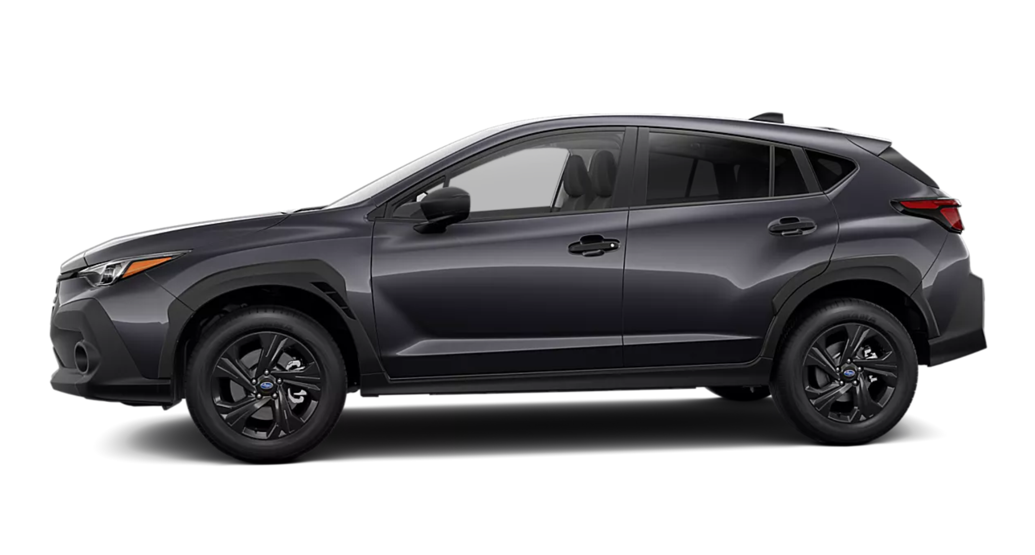 Side profile of the 2025 Subaru Crosstrek Base AWD highlighting its aerodynamic body, black alloy wheels, and compact SUV stance.