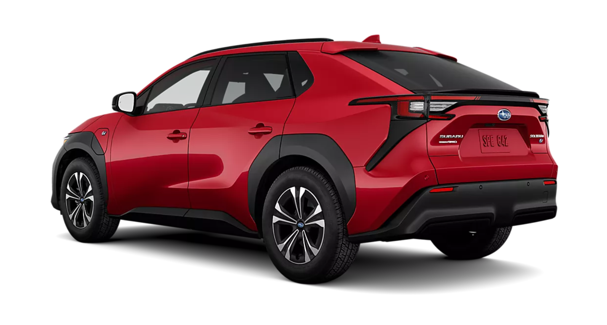 Rear view of the 2025 Subaru Solterra Premium AWD in red, showcasing taillights, EV badging, and modern SUV styling.