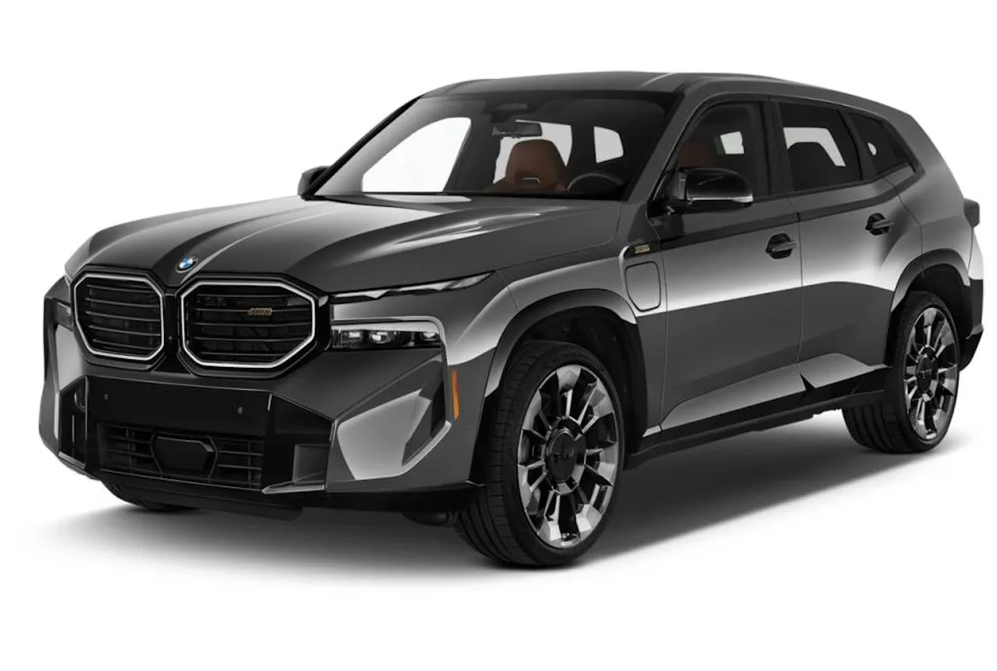 Front angle of the 2025 BMW XM PHEV AWD with illuminated kidney grille, sculpted hood, and aggressive LED lighting.