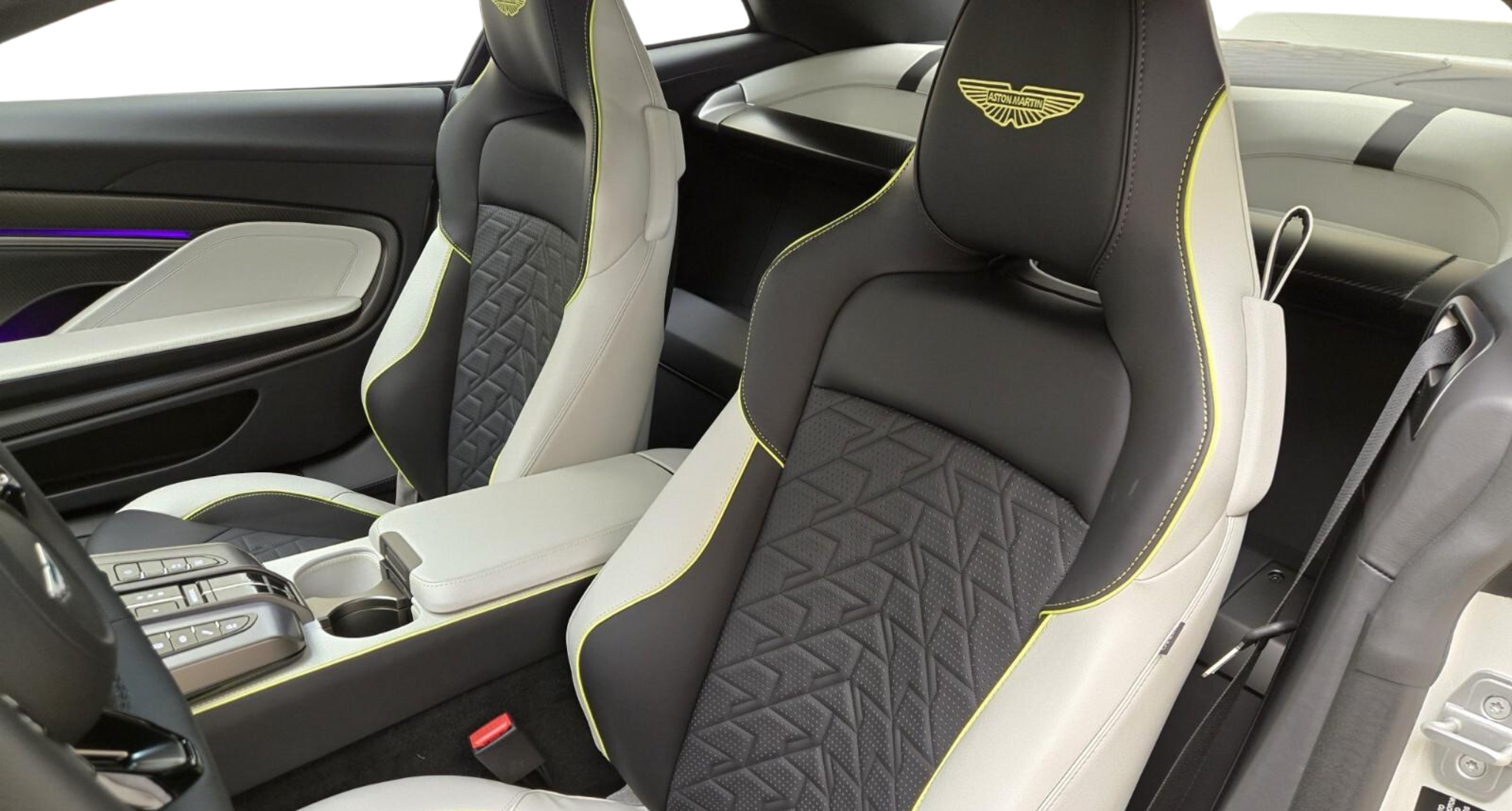 Premium leather sport seats inside the 2025 Aston Martin Vanquish Coupe with yellow contrast stitching and diamond pattern inserts.