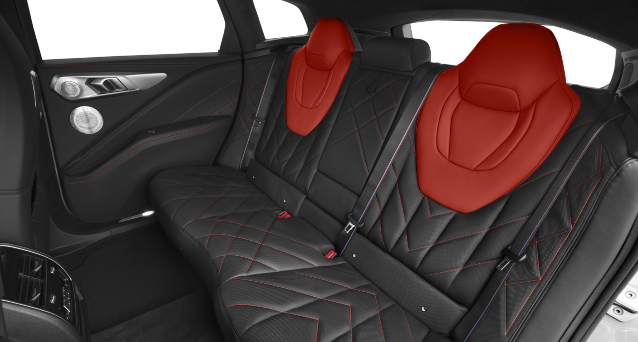 Rear seat view of the 2025 BMW XM PHEV AWD with diamond-stitched Merino leather and red M headrest accents.